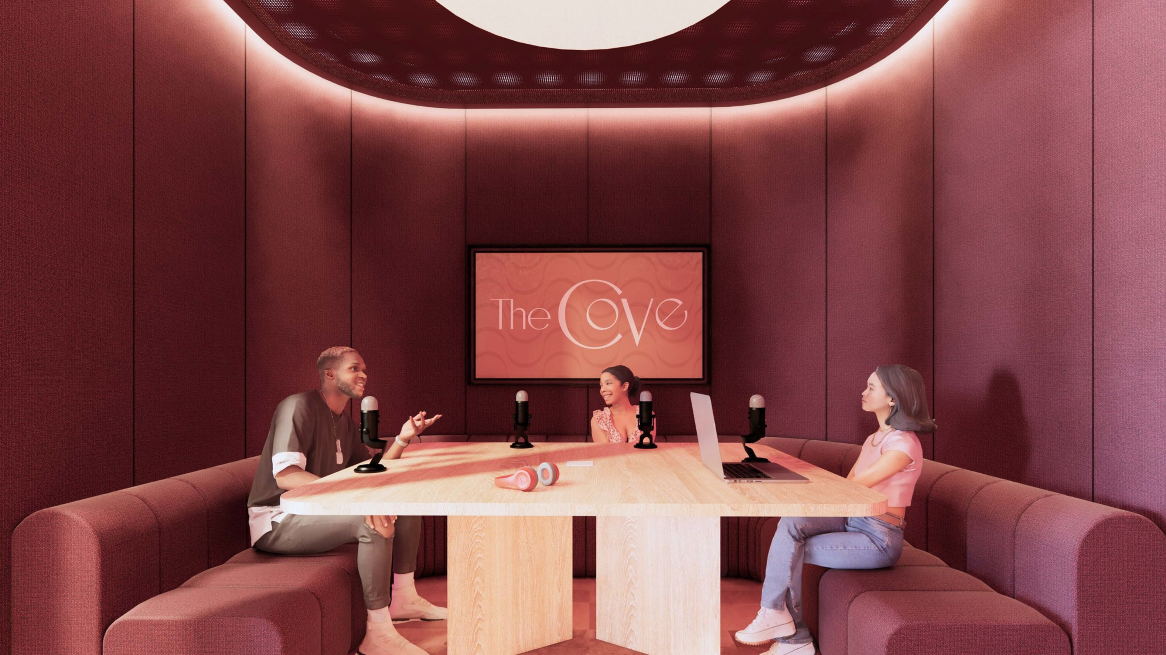 two people sit in a purple booth