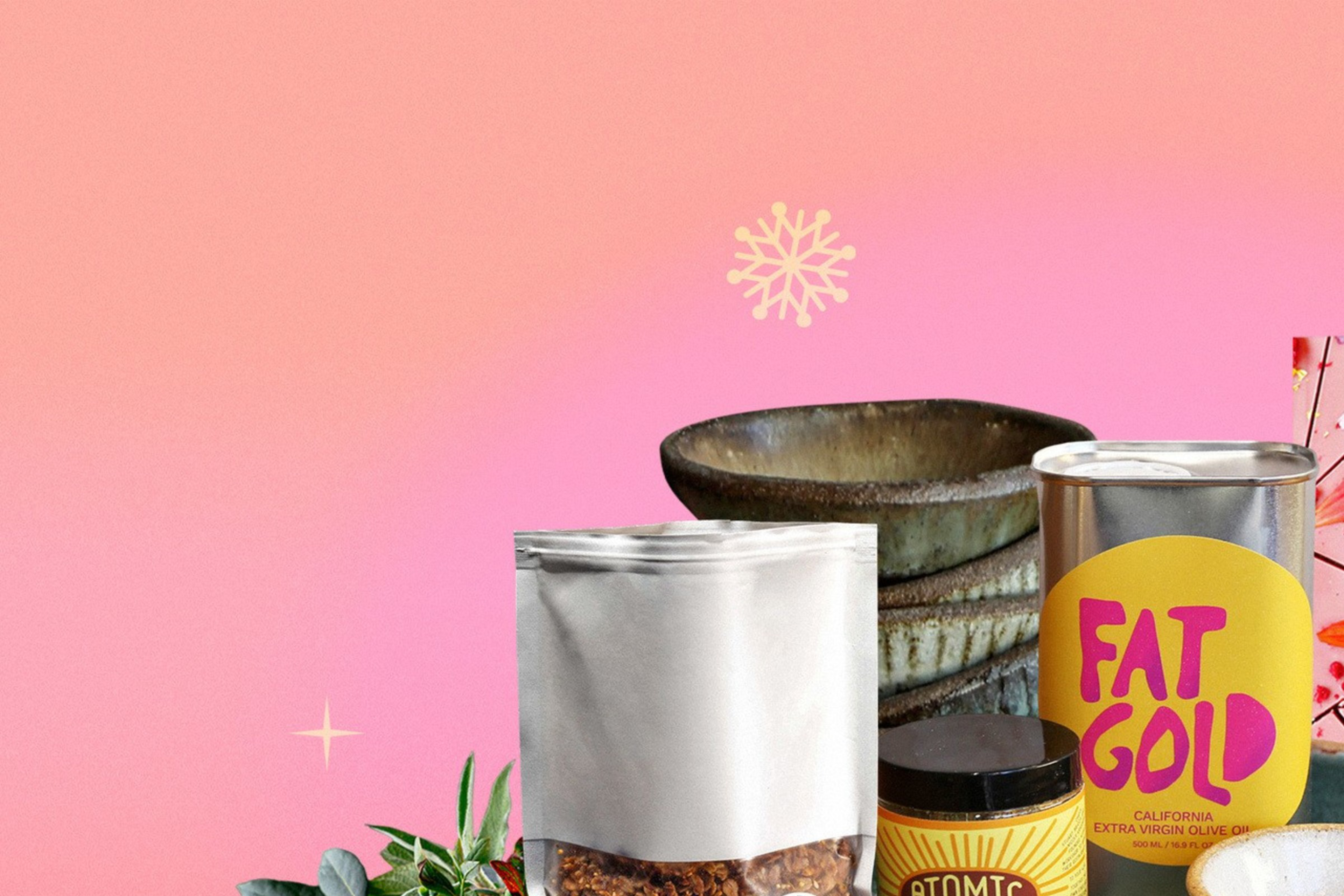 A group of holiday gift items including a cook book, chili oil, sardines, and more.