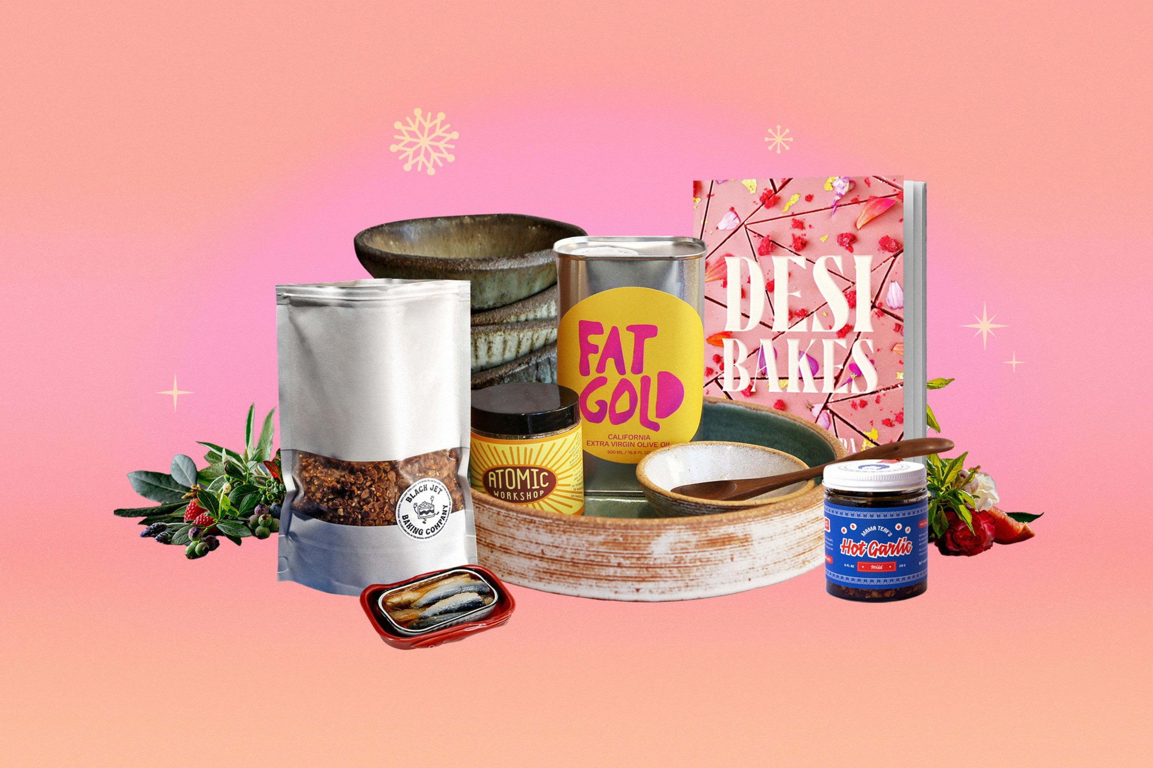 A group of holiday gift items including a cook book, chili oil, sardines, and more.