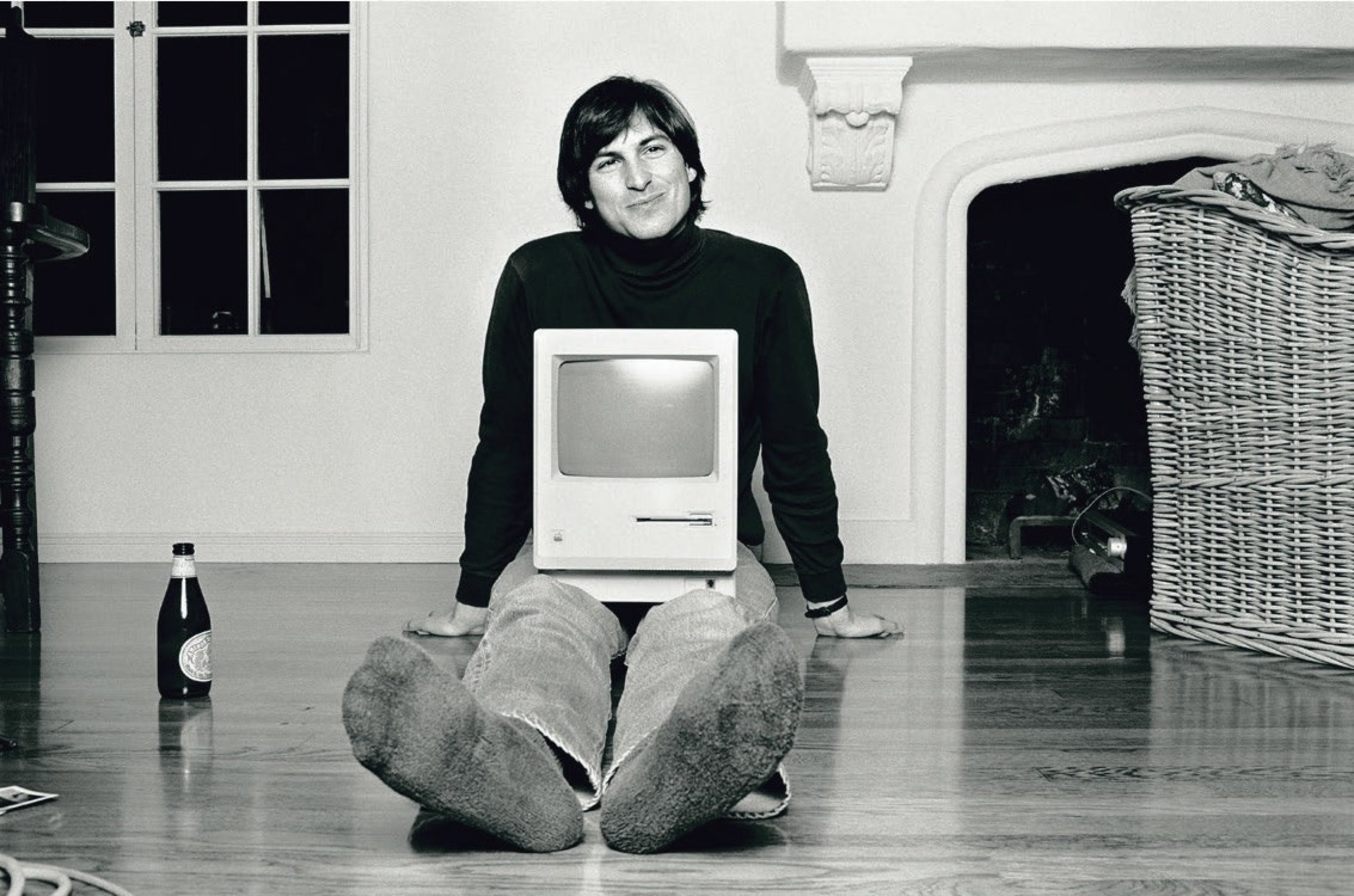Man with computer and beer bottle