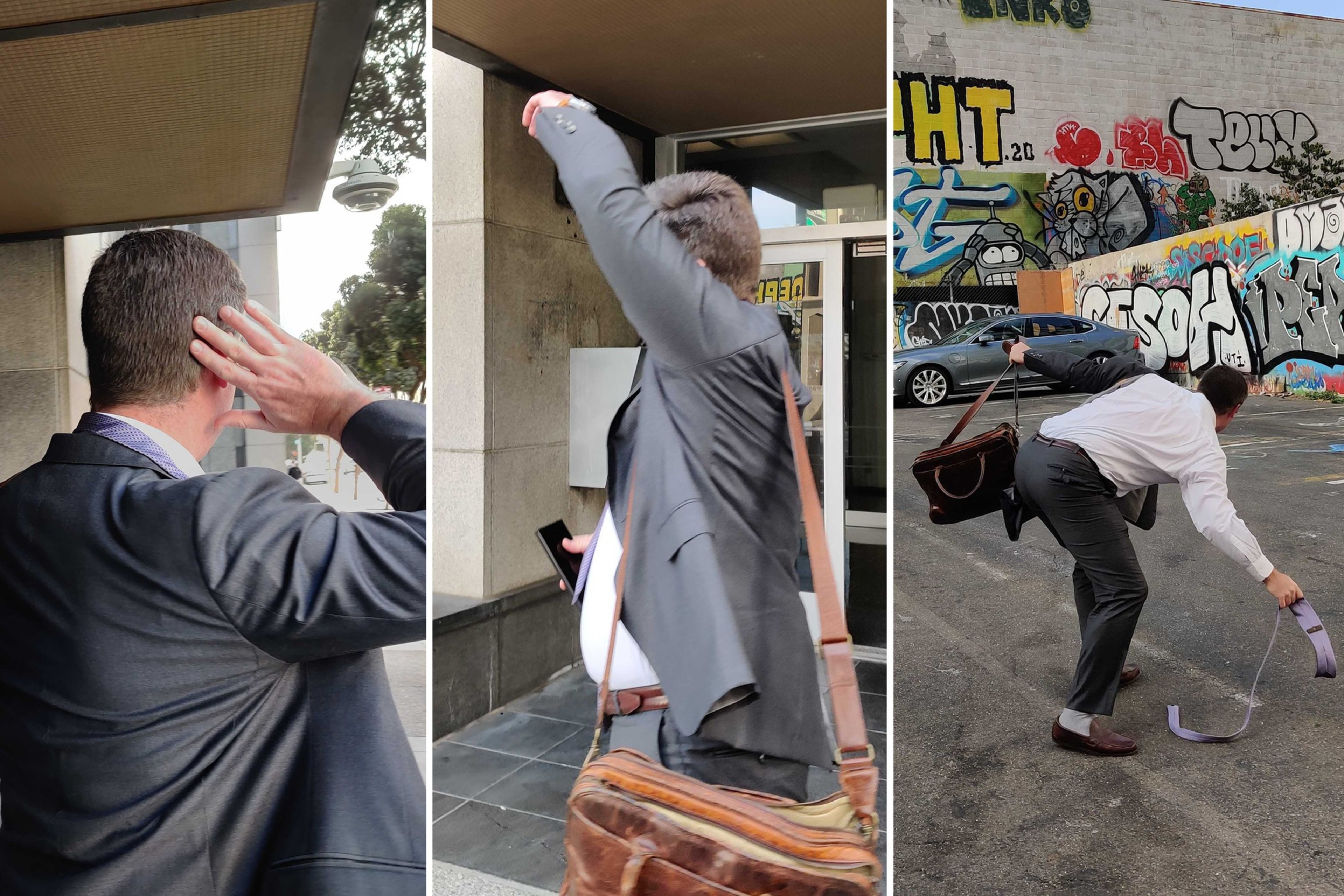 A man in a suit outdoors reacts to something behind him, then raises his arm as if to block, and finally bends down to pick up a fallen belt in a graffiti-covered parking lot.