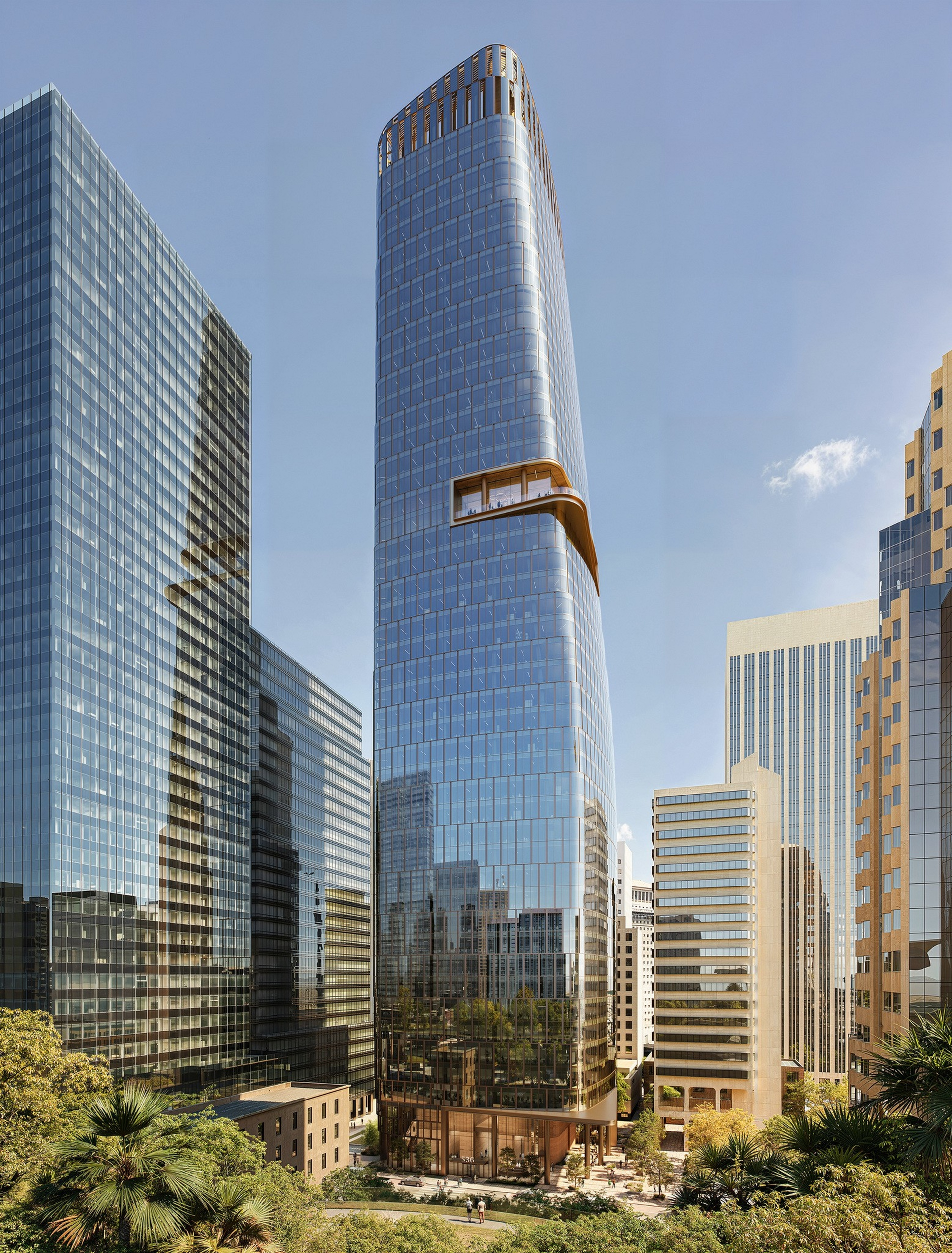 A sleek, curved glass skyscraper with a distinctive cantilevered section near the top stands among other tall buildings under a clear sky.