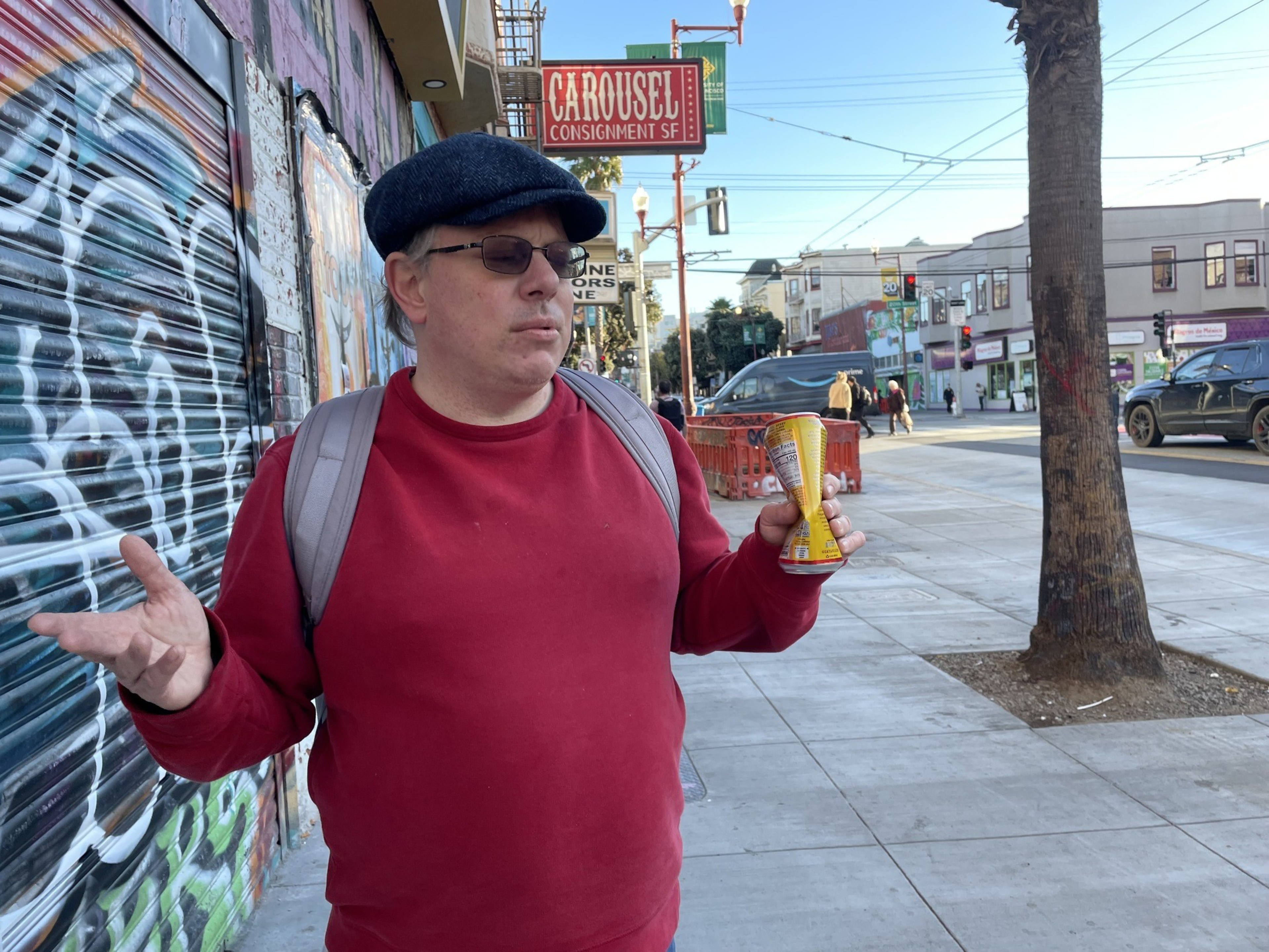 A man speaks to a reporter.