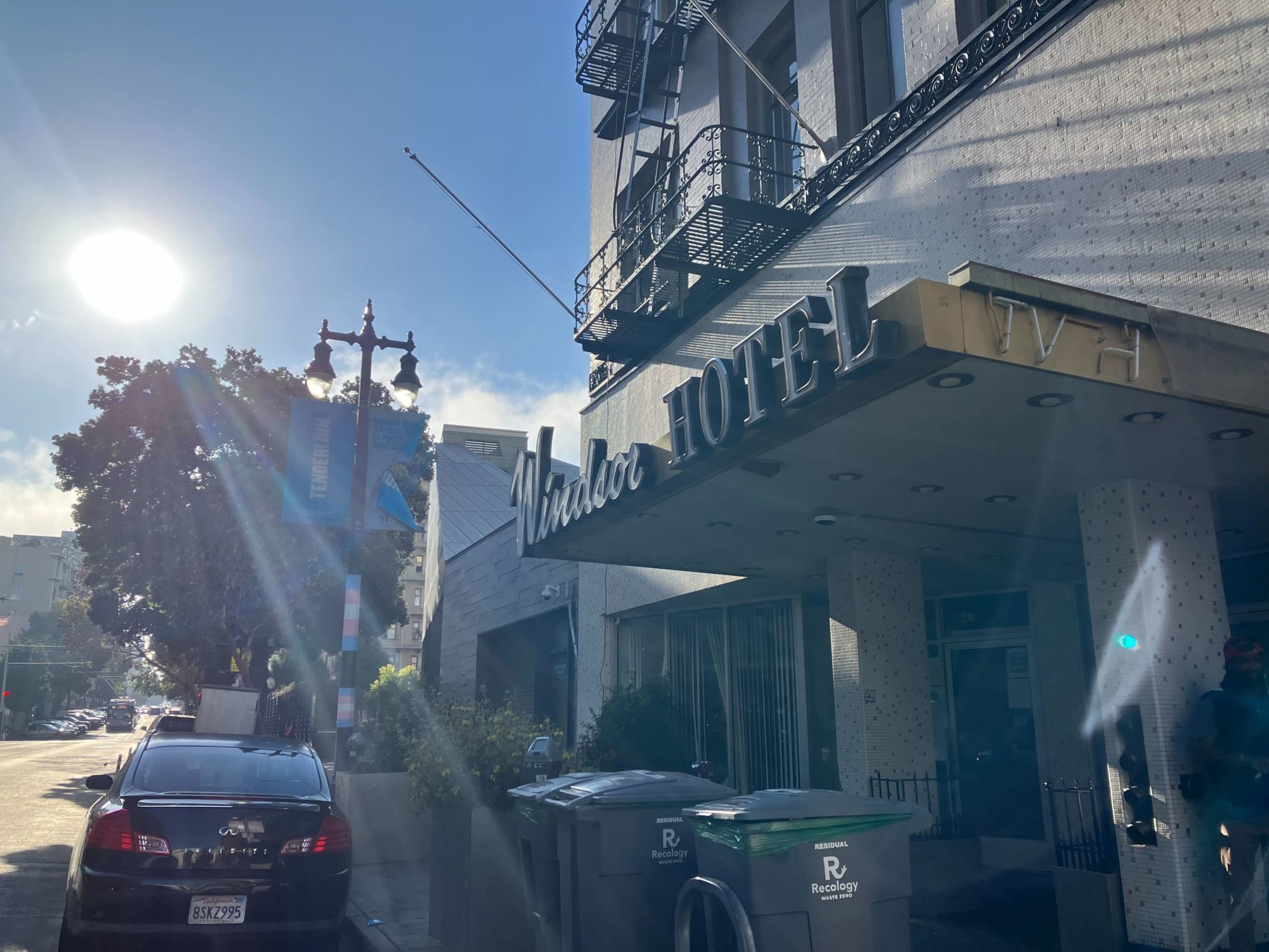 The text seems to be a description of a picture. Here's a clearer and corrected version:  The picture shows the Windsor Hotel with the sun in the background.