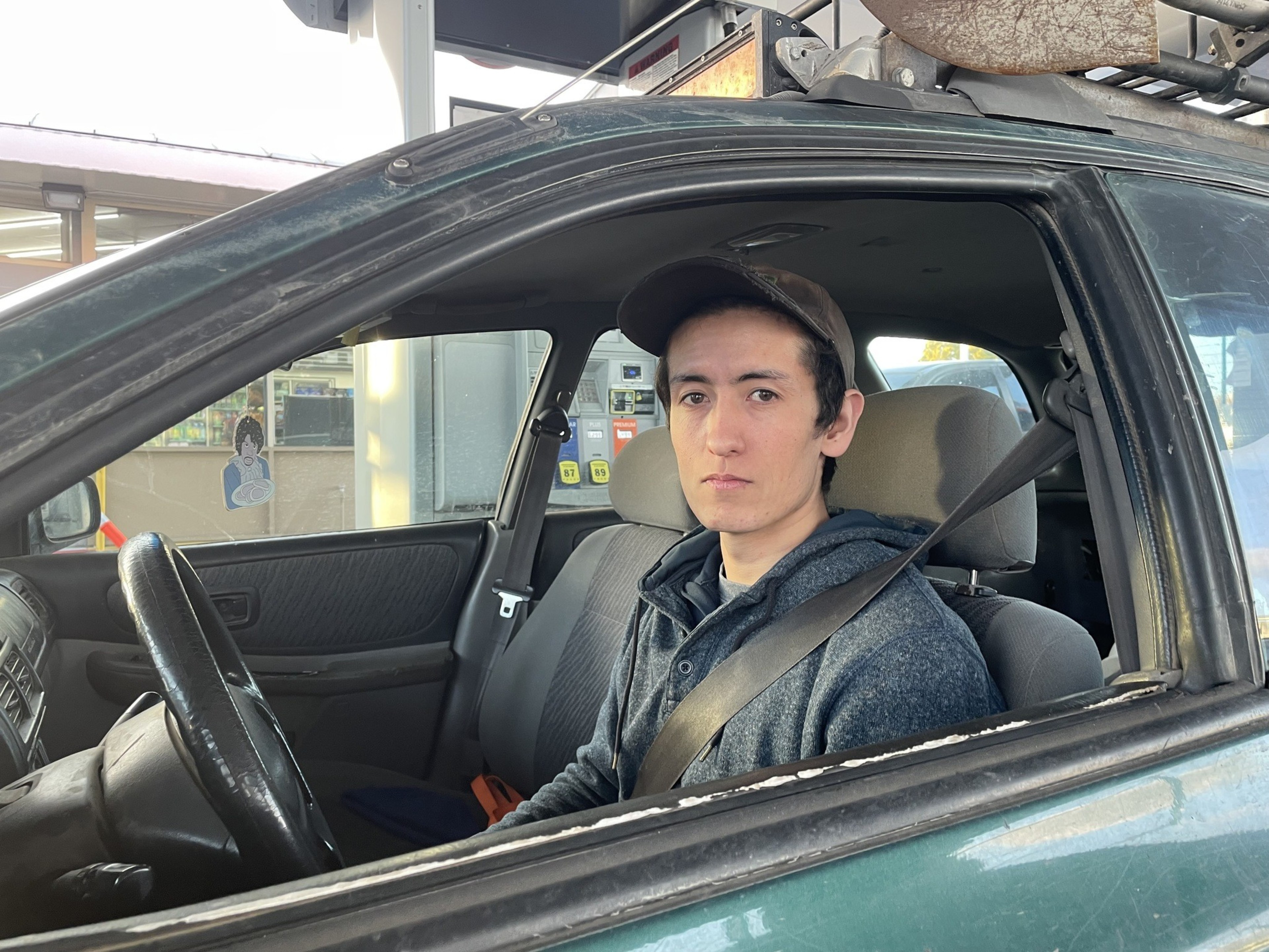 A man sits in his car.1
