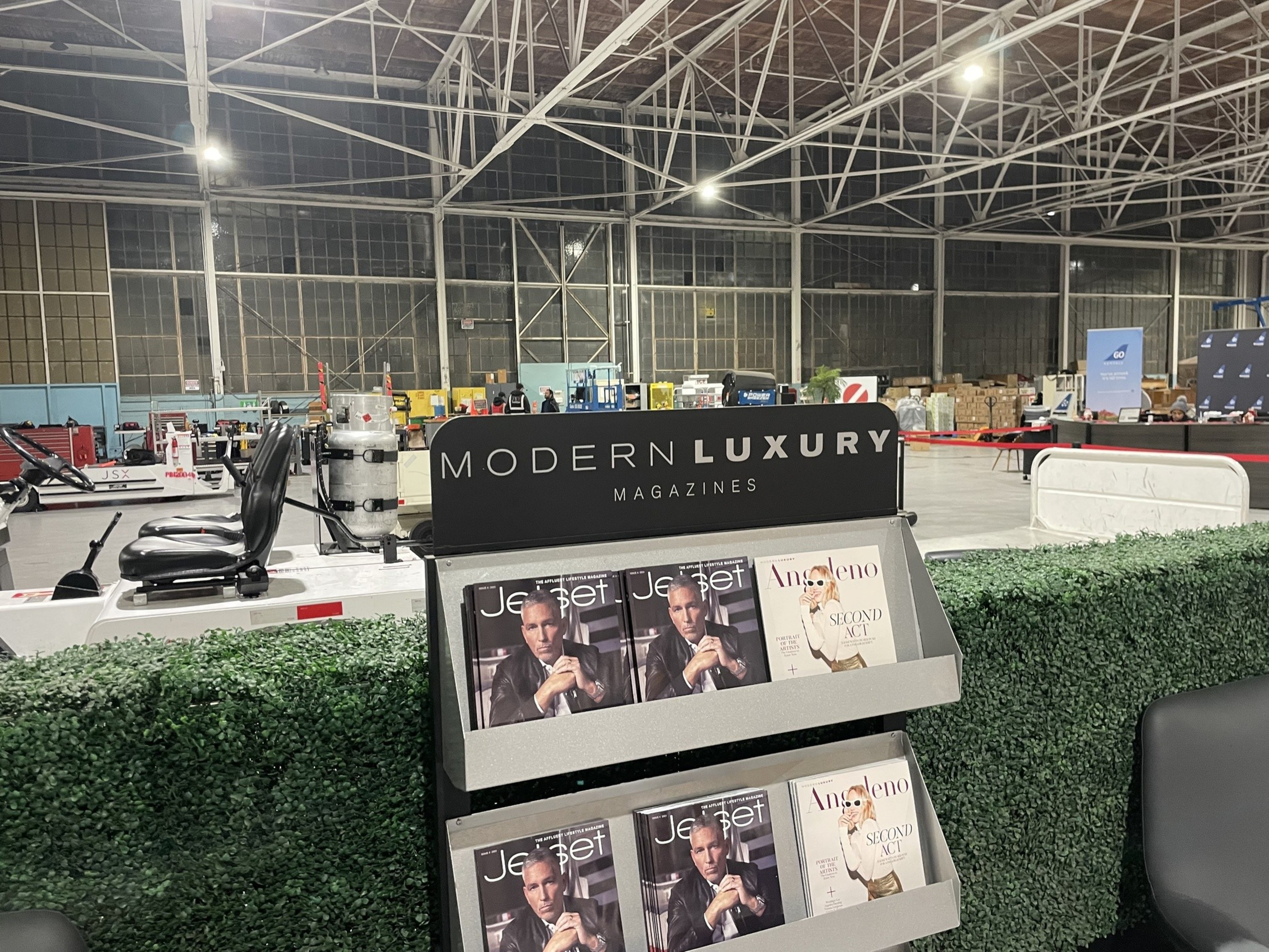 An airplane hangar of has a modern luxury magazine rack.