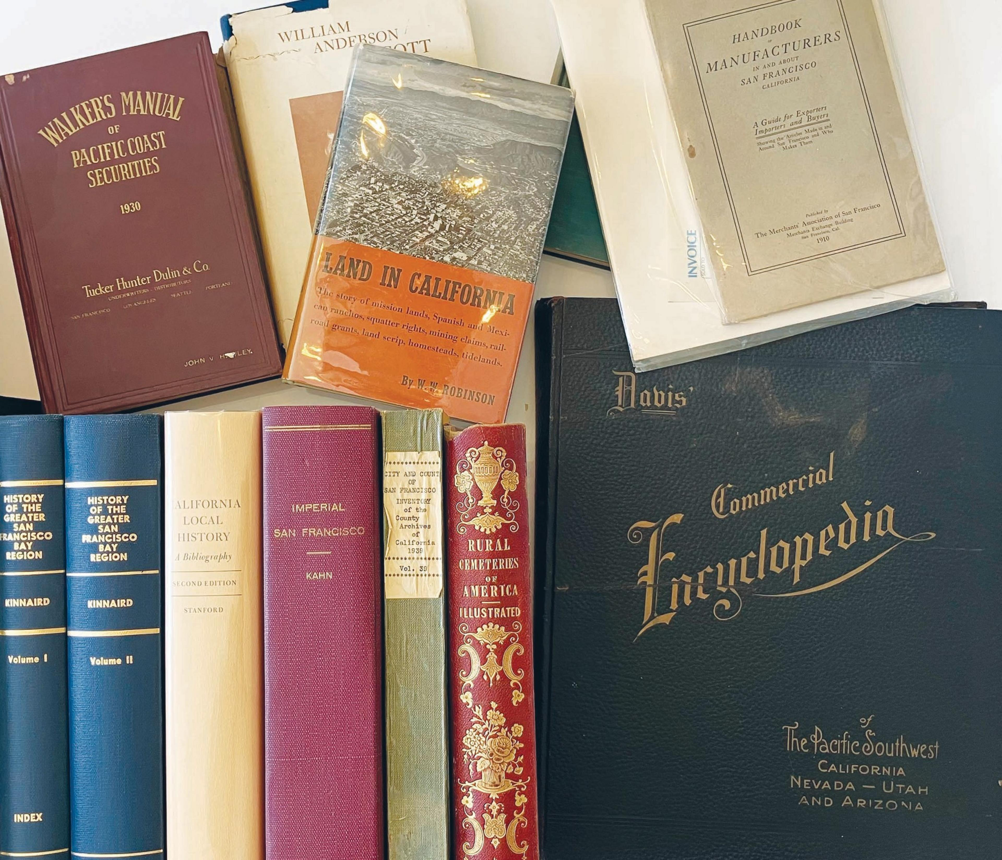 A collection of antique books, some with titles on Californian themes, history, and finance.