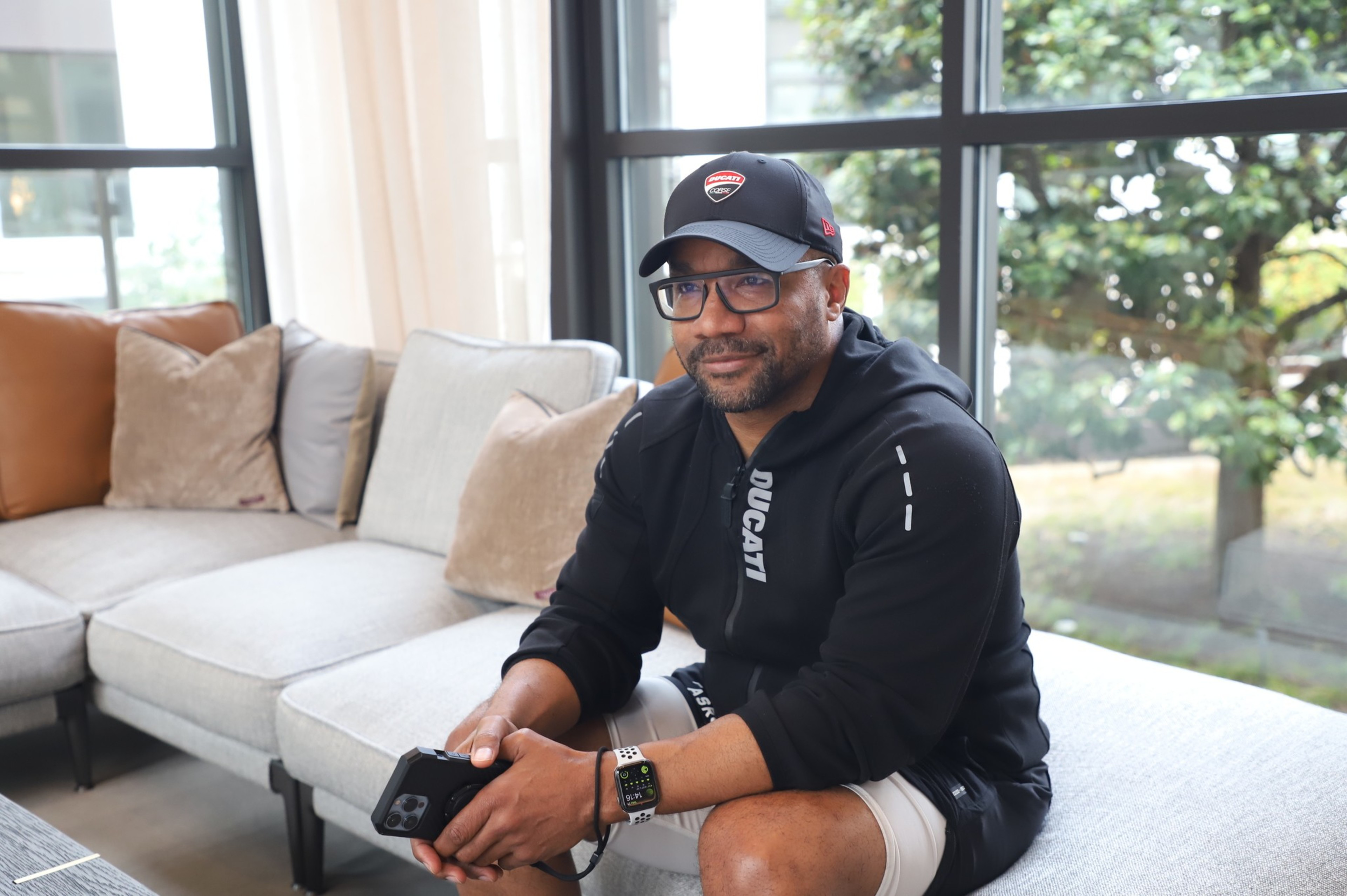 A man sits on a couch.
