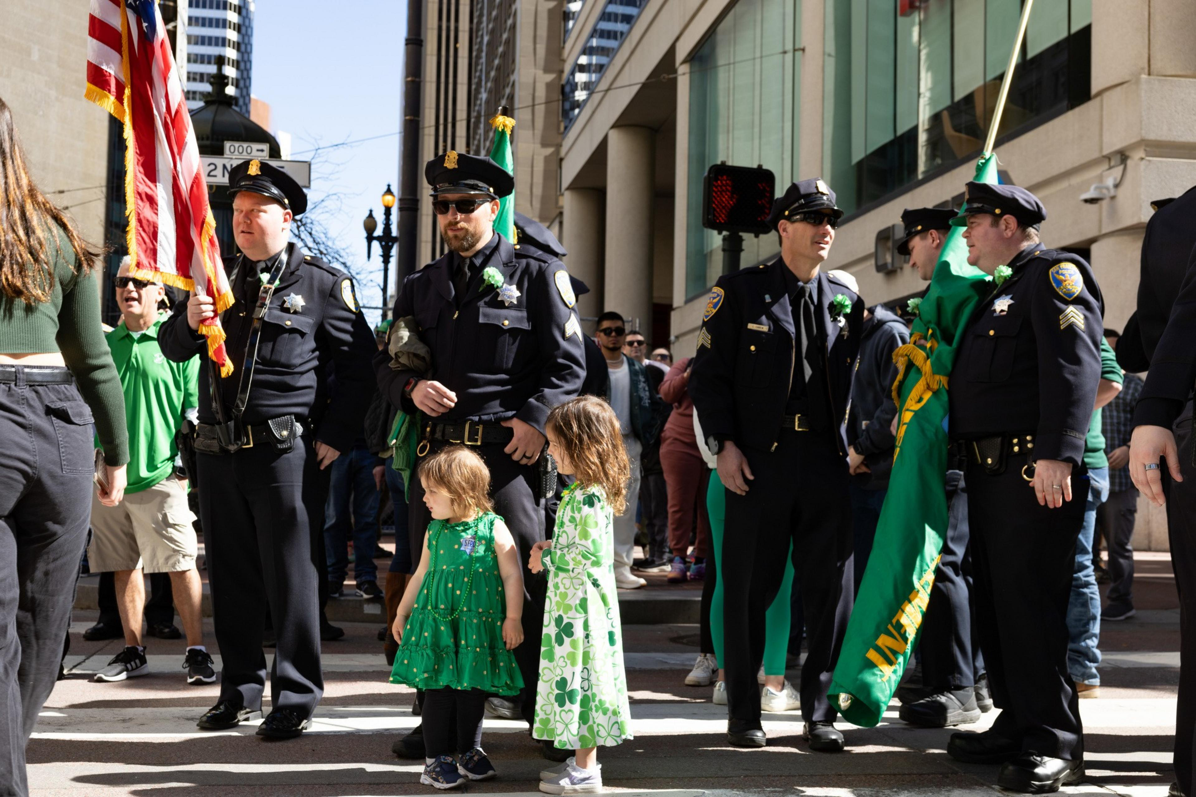 Police and children at the St. Patrick's Day Parade in San Francisco