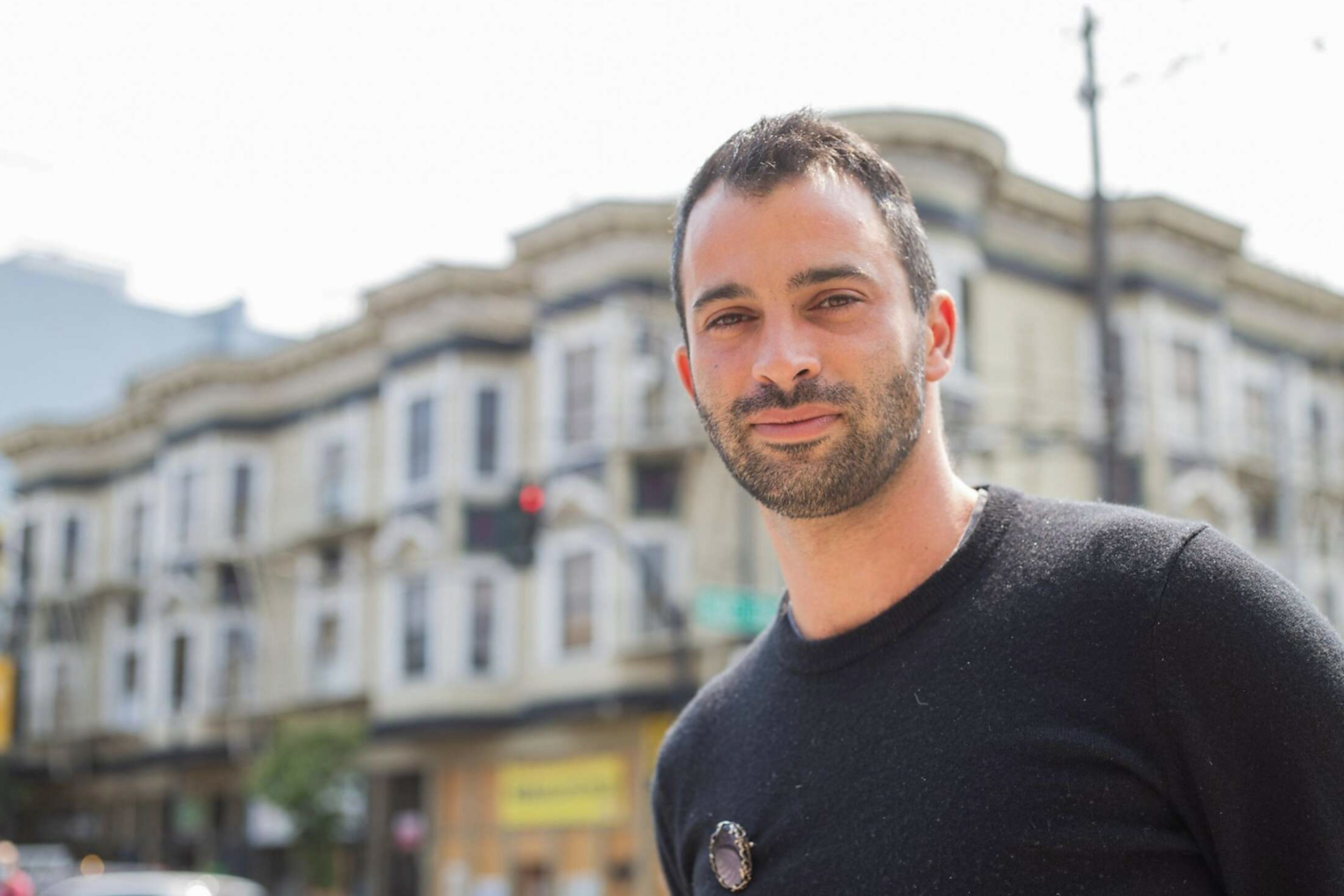 Manny Yekutiel poses for a portrait photo on the streets of San Francisco.