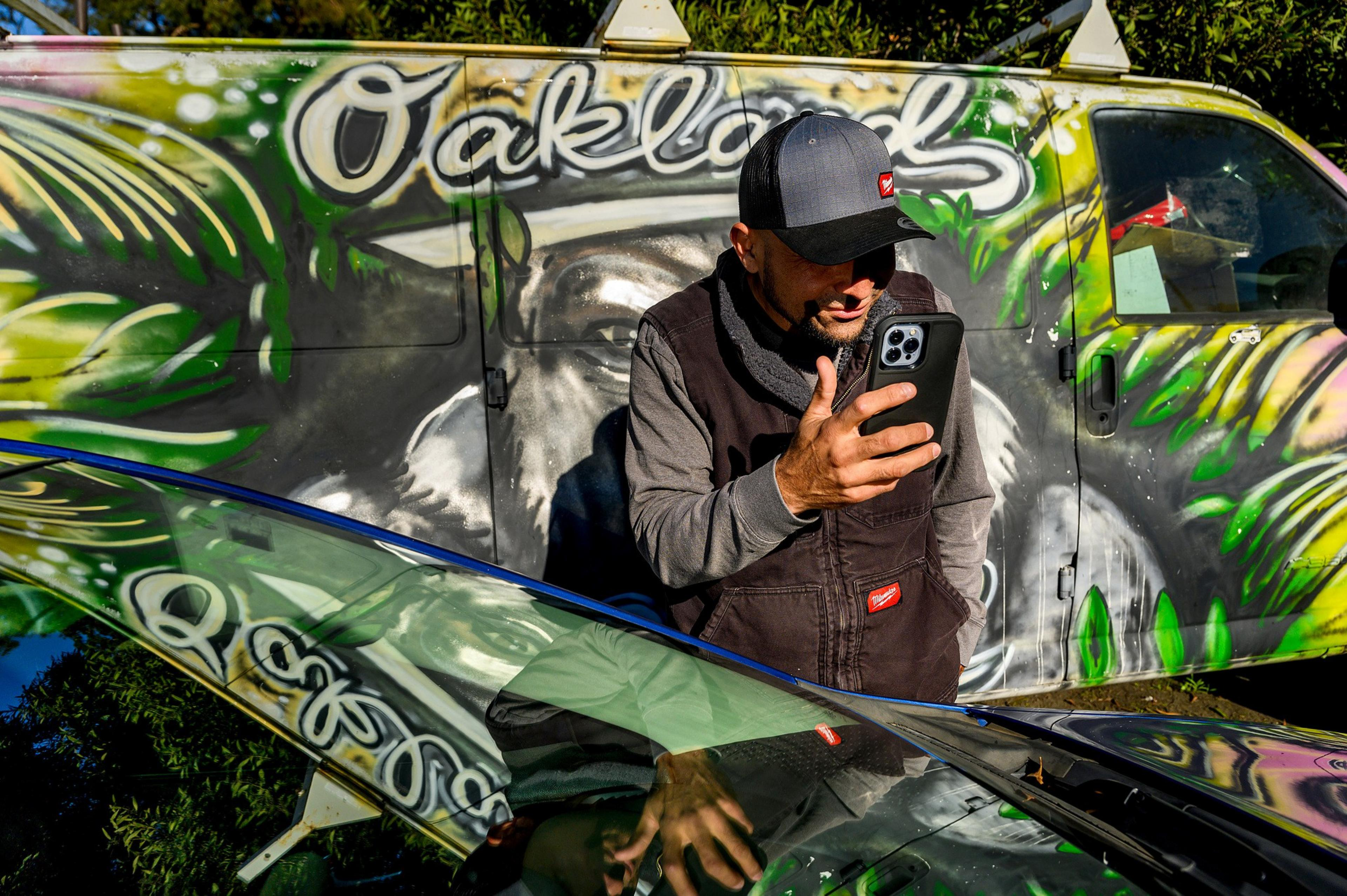 Gregorio Ramon, whose social media posts about Oakland life have been gaining followers, stands for a portrait outside La Casa de Maria restaurant on Saturday, Feb. 10, 2024, in Oakland. Ramon uses the phrase â€œOakland California donde la vida no vale nadaâ€