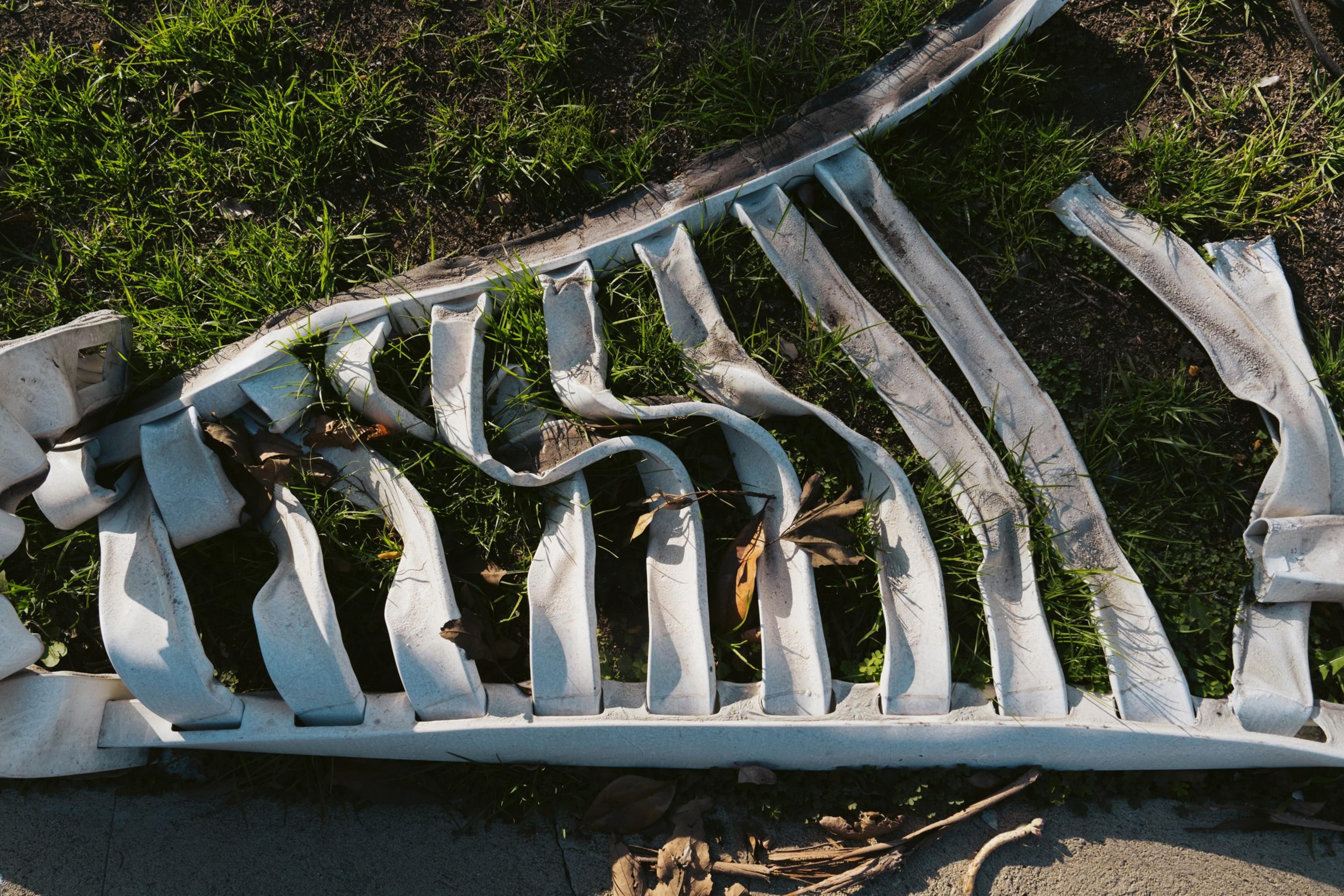 A melted white fence is seen in Pacific Palisades in Los Angeles on Thursday, Feb. 20, 2025.