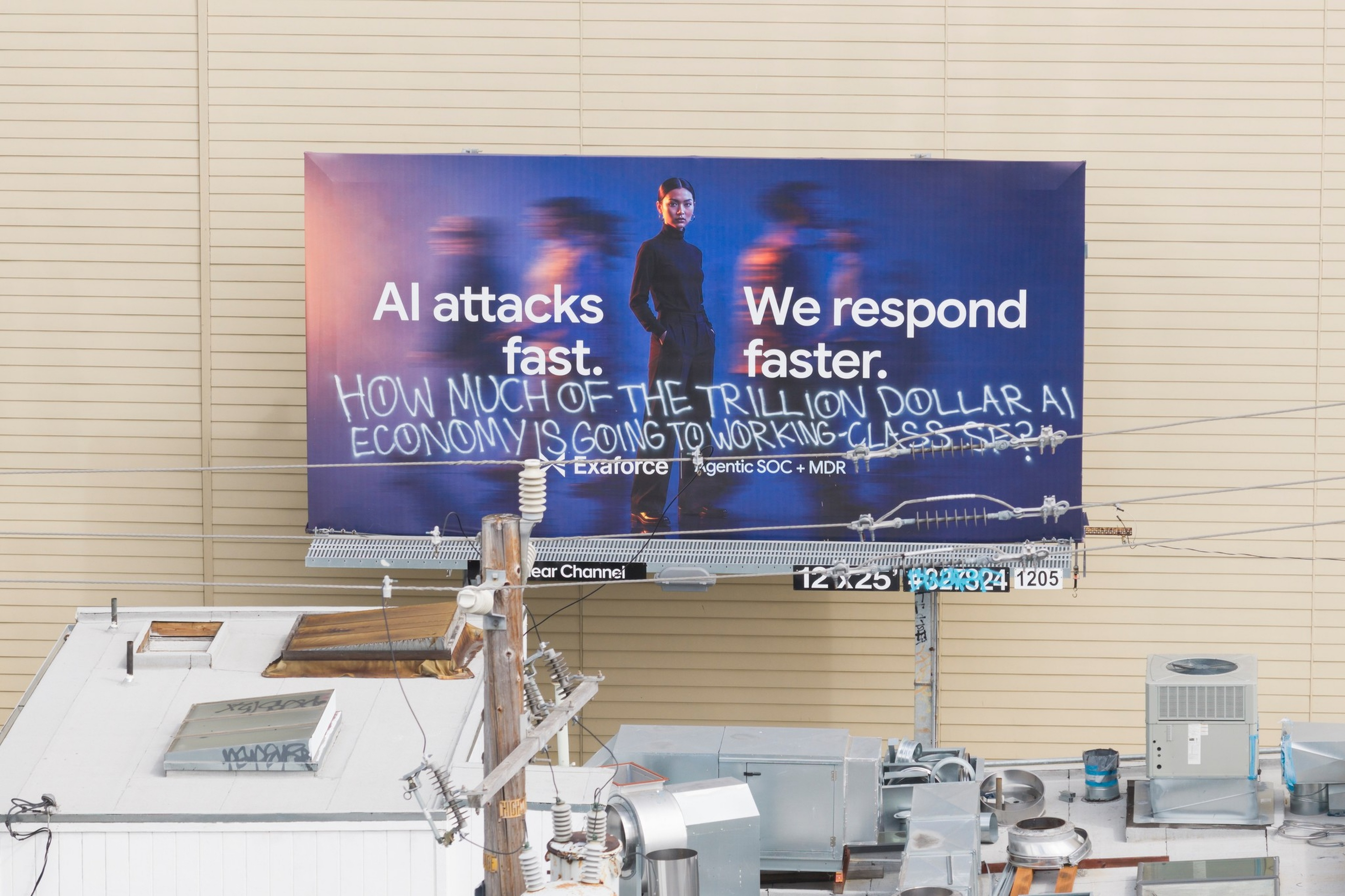 A billboard reads “AI attacks fast. We respond faster.” with graffiti ...