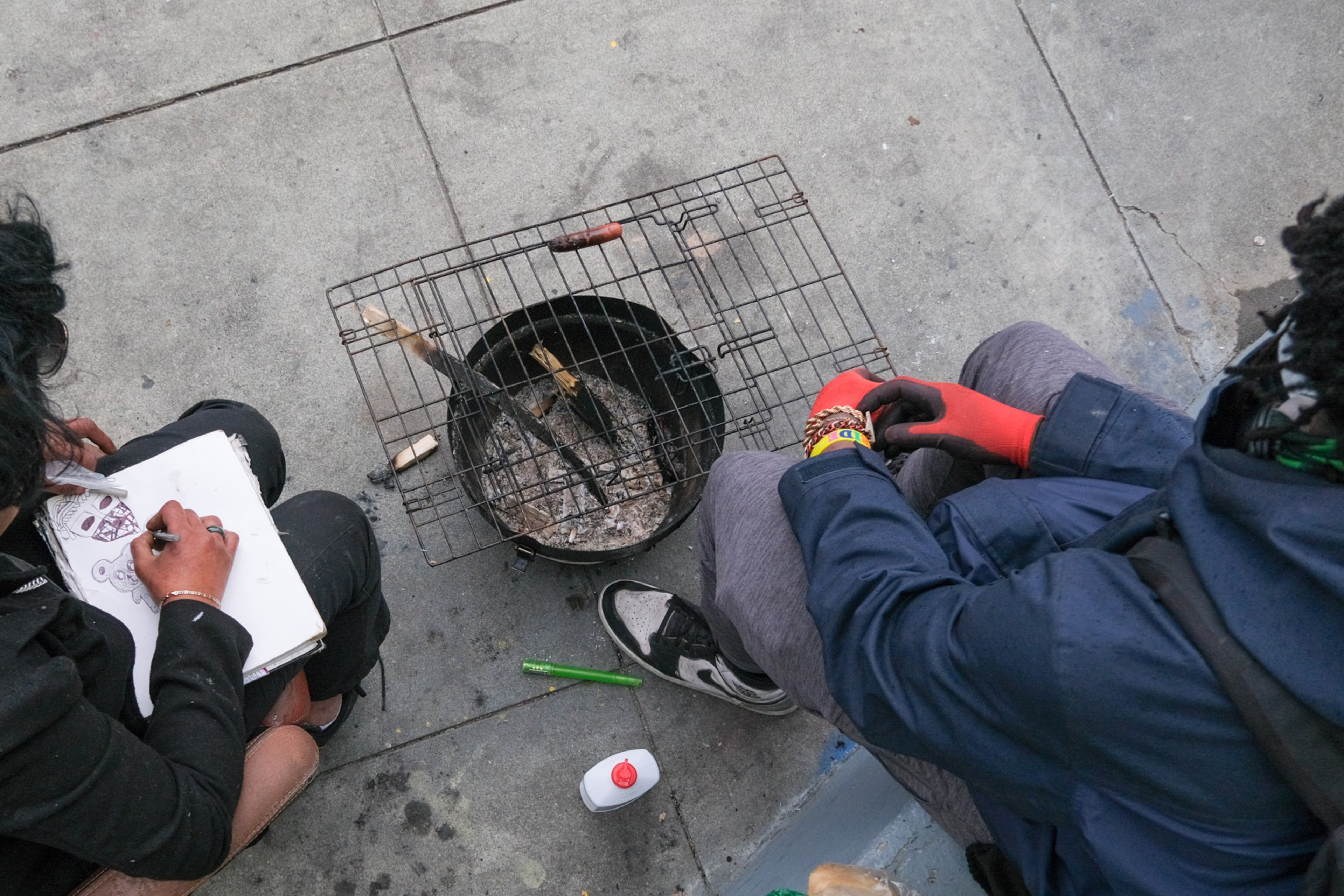 People cook on a grill.