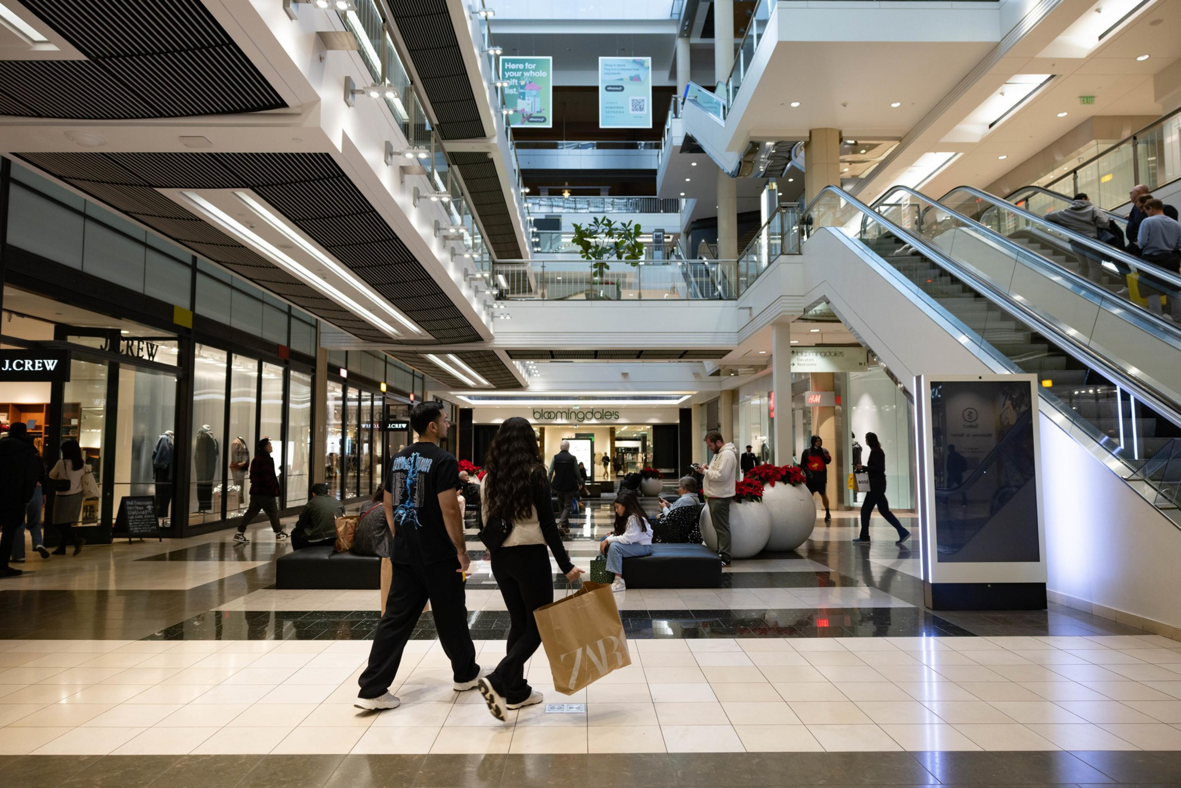 Shoppers walk in San Francisco Centre.