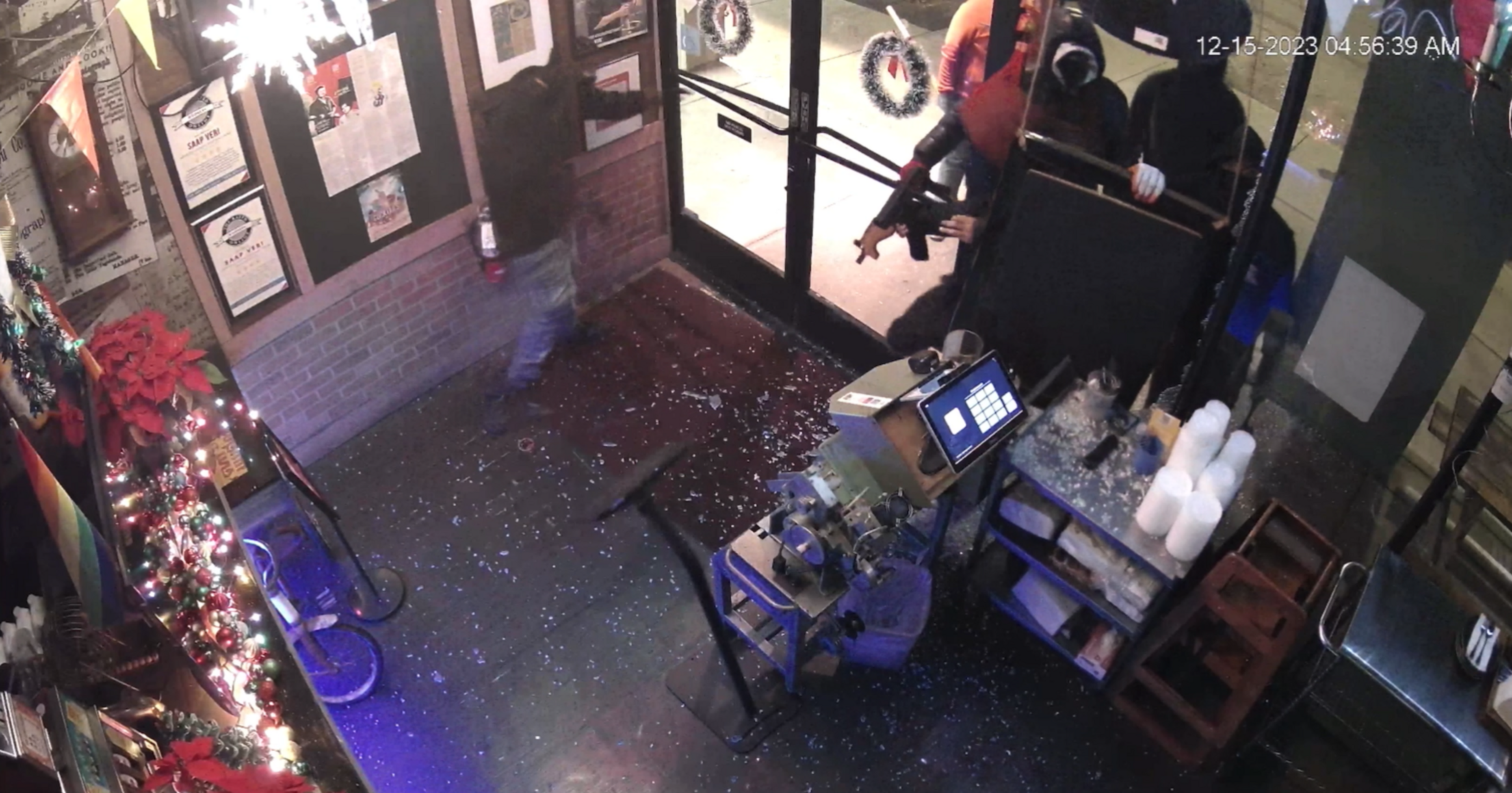 Thieves break into a business by smashing a window.