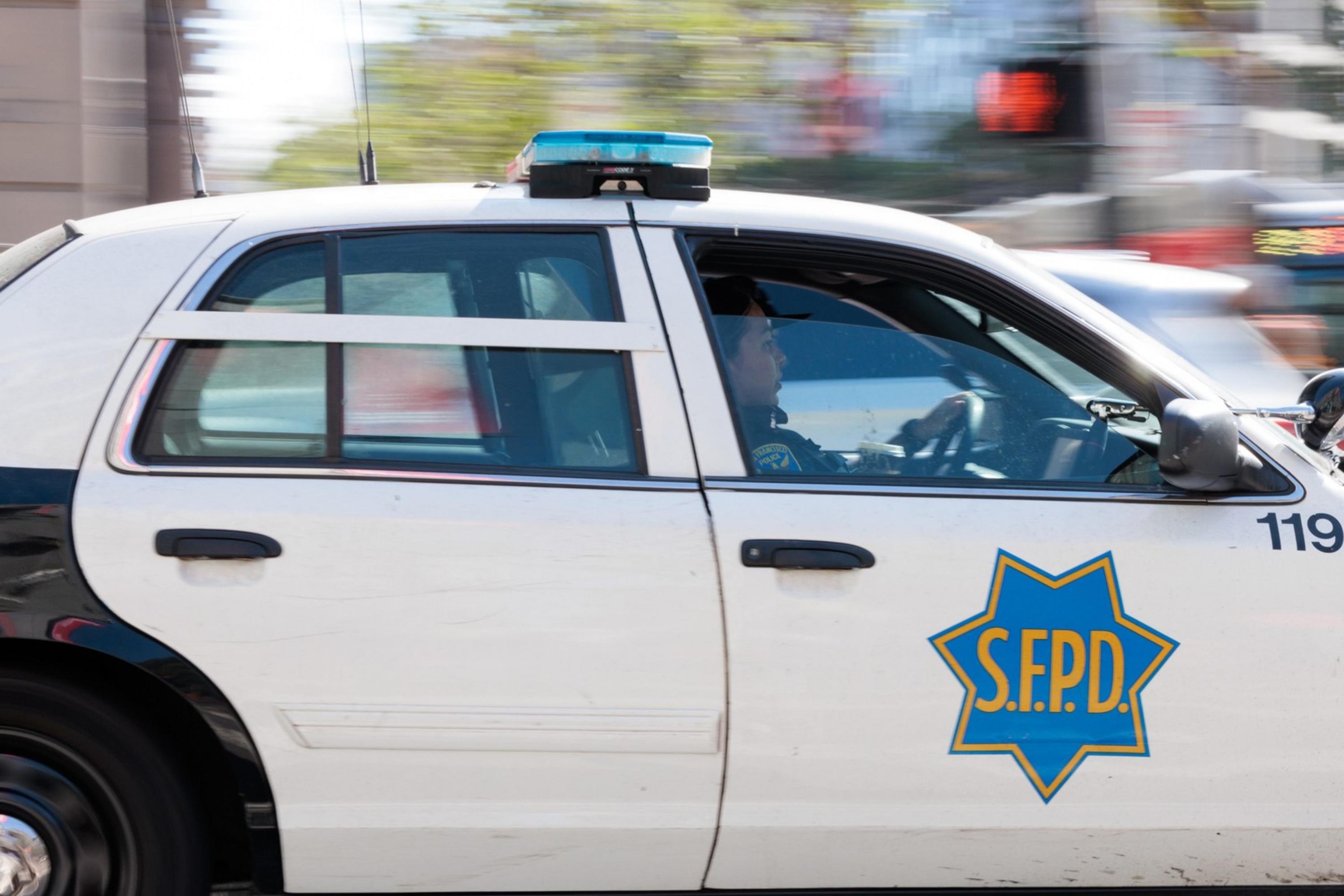 A San Francisco police car is seen driving at speed.