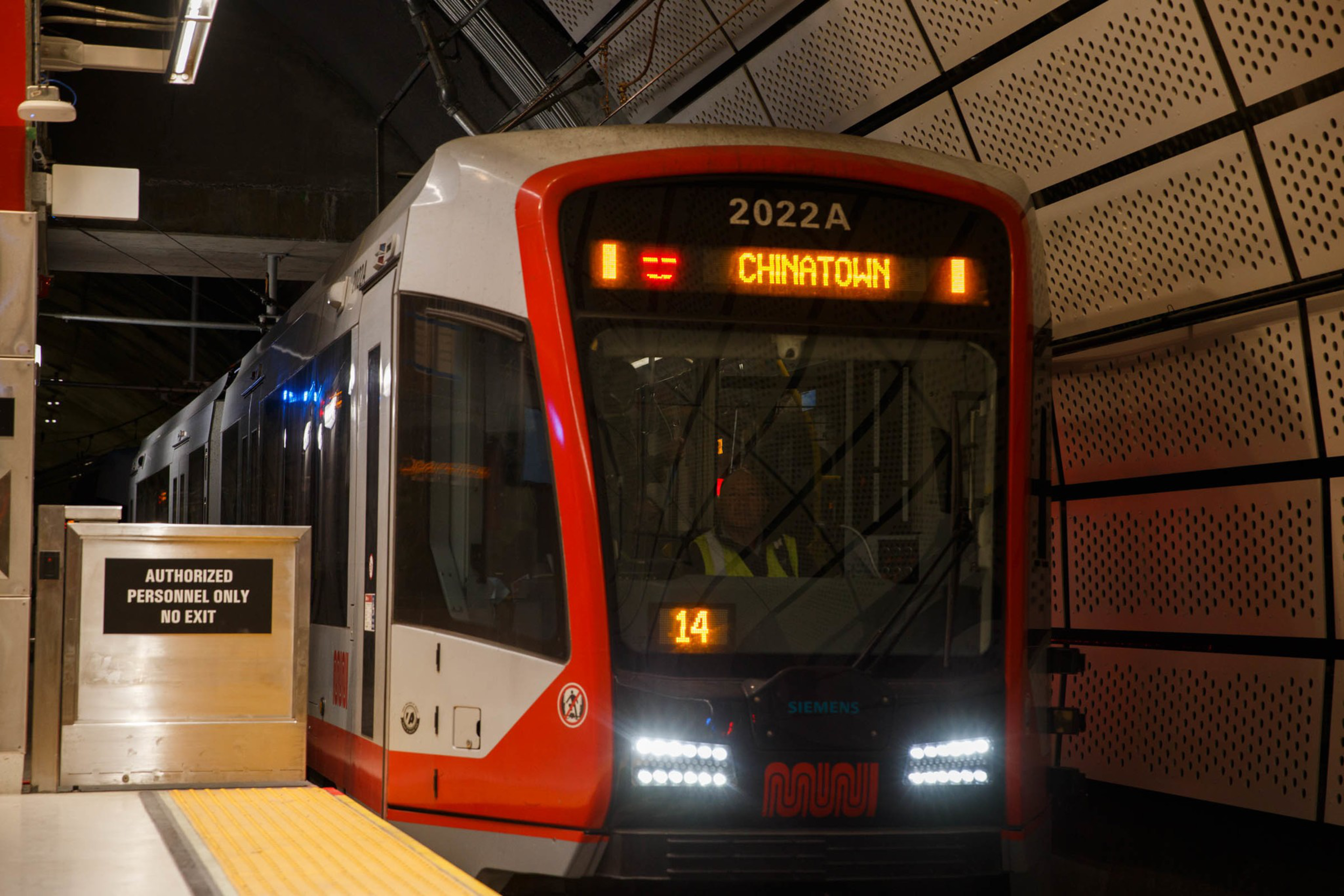 A train pulls into a subway station.