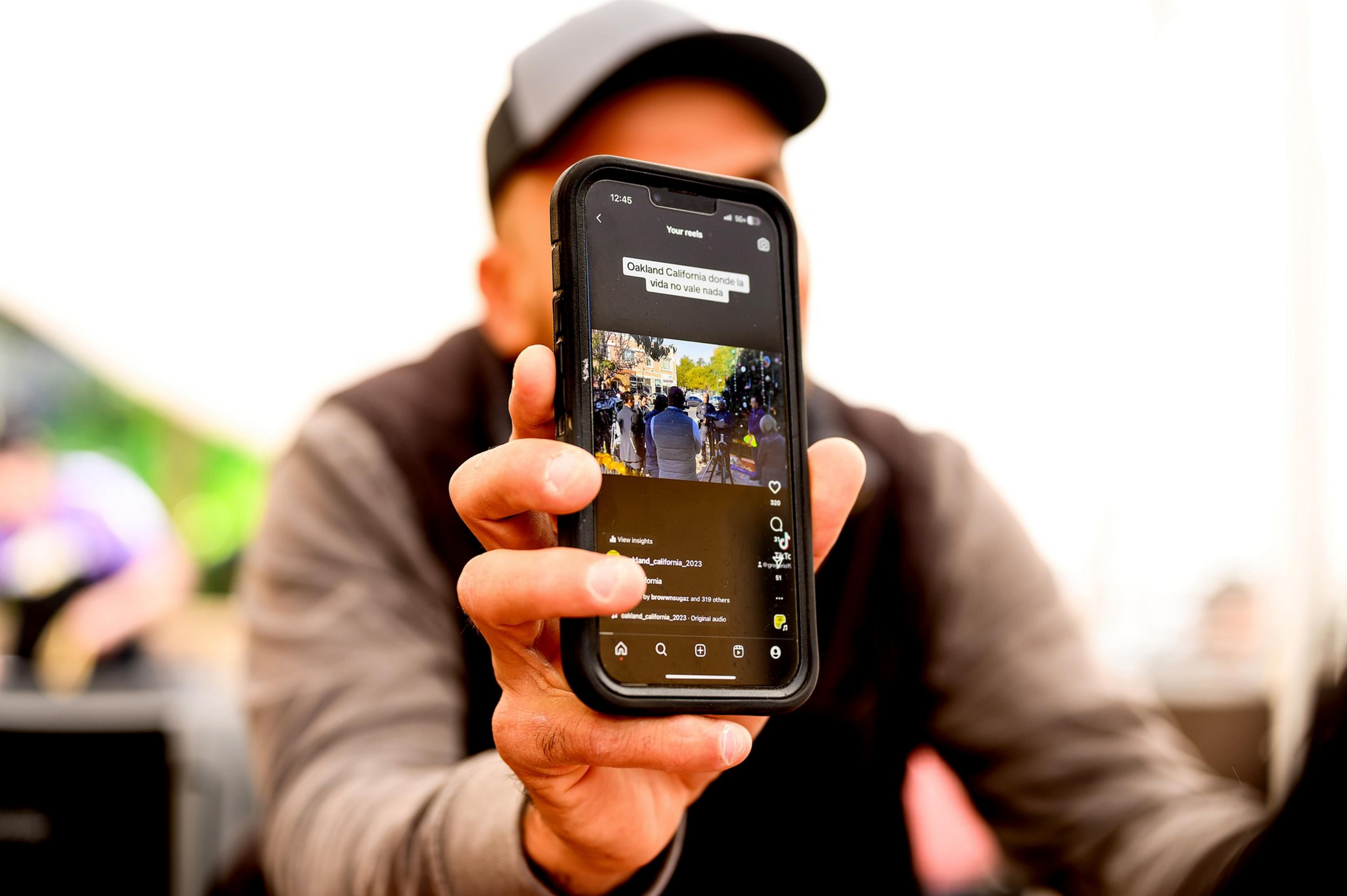 Gregorio Ramon, whose social media posts about Oakland life have been gaining followers, displays one of his videos at La Casa de Maria restaurant on Saturday, Feb. 10, 2024, in Oakland.