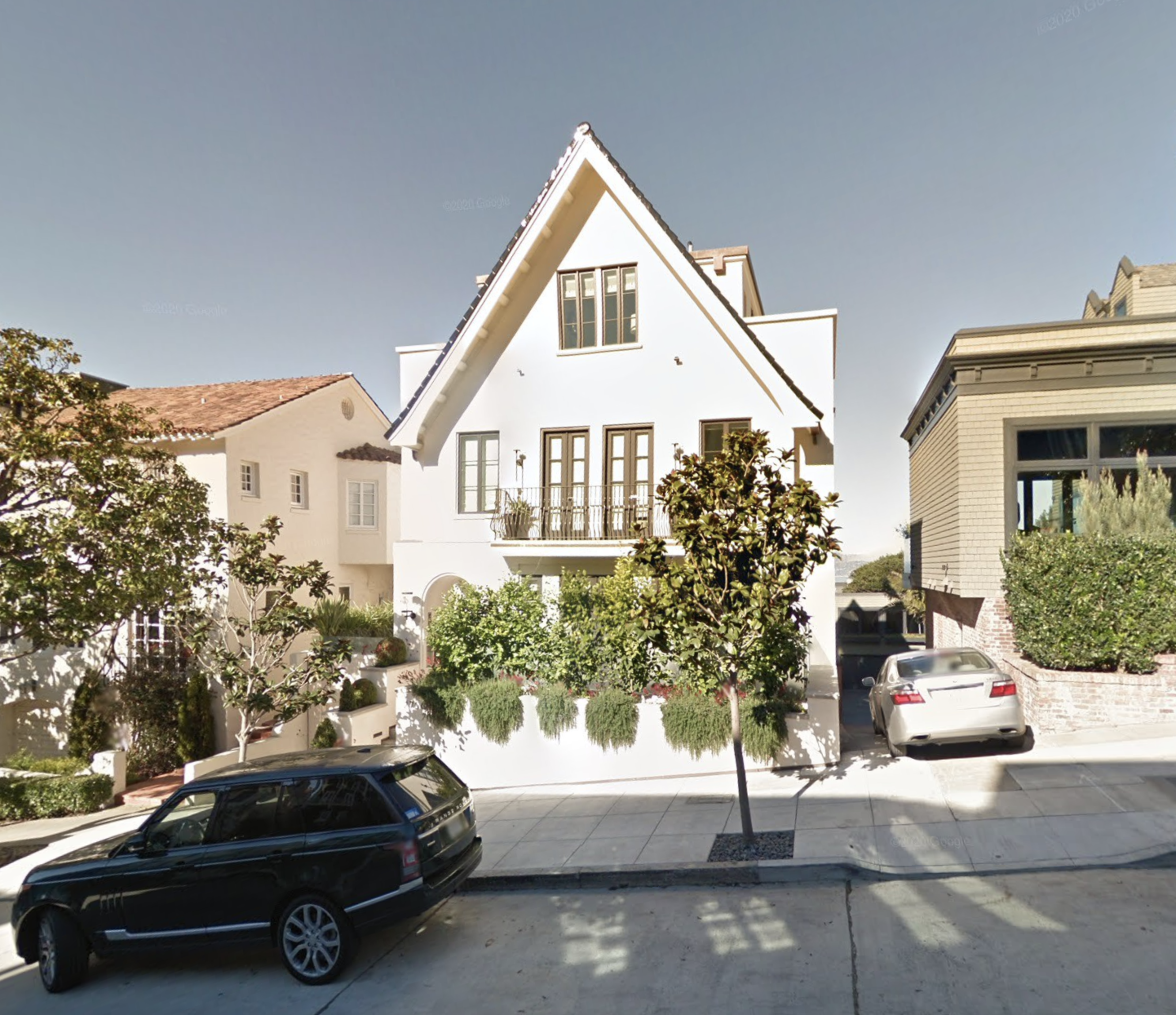 A mansion is seen from the front.