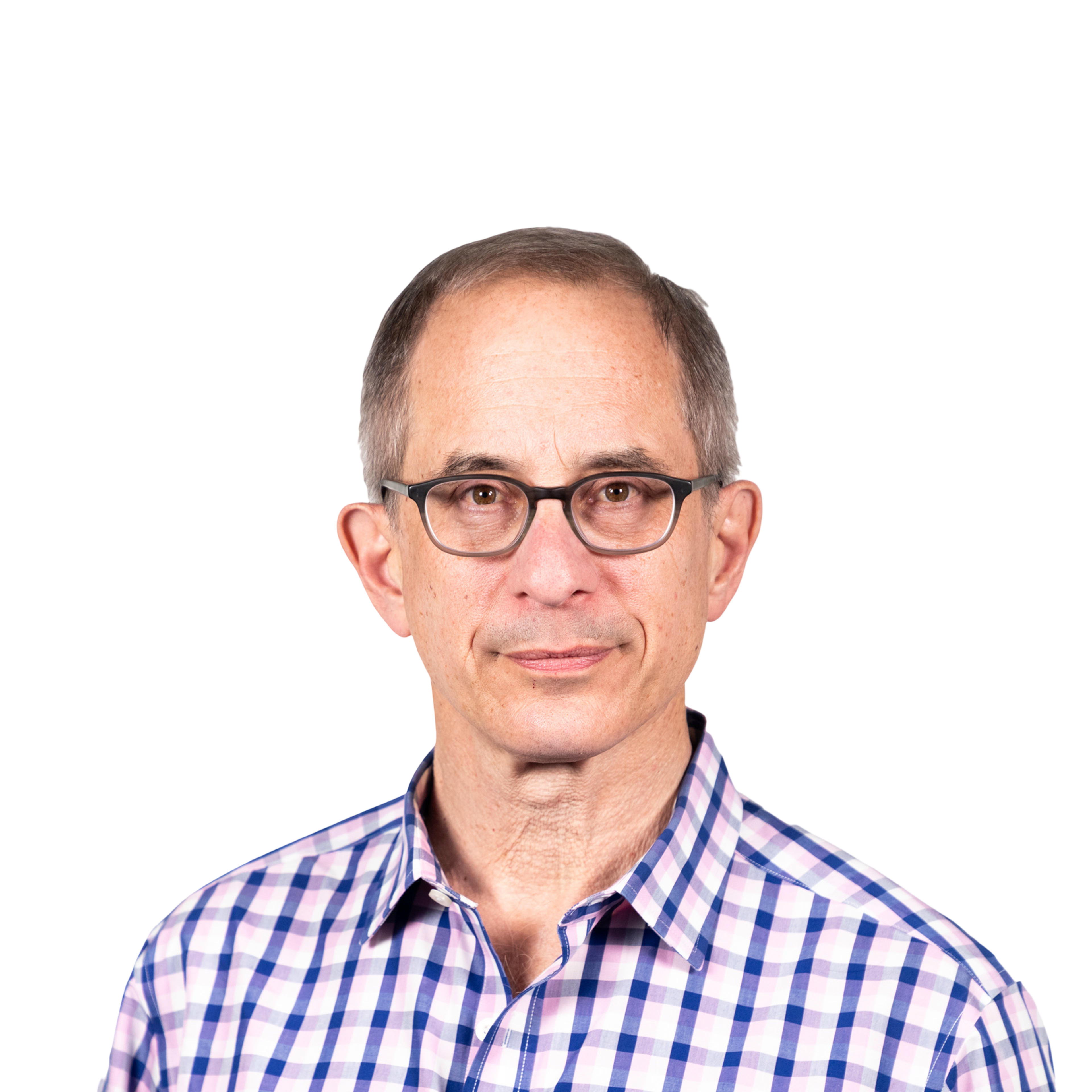 A middle-aged man with short gray hair and glasses wears a purple and white checkered shirt, looking calmly at the camera against a plain background.