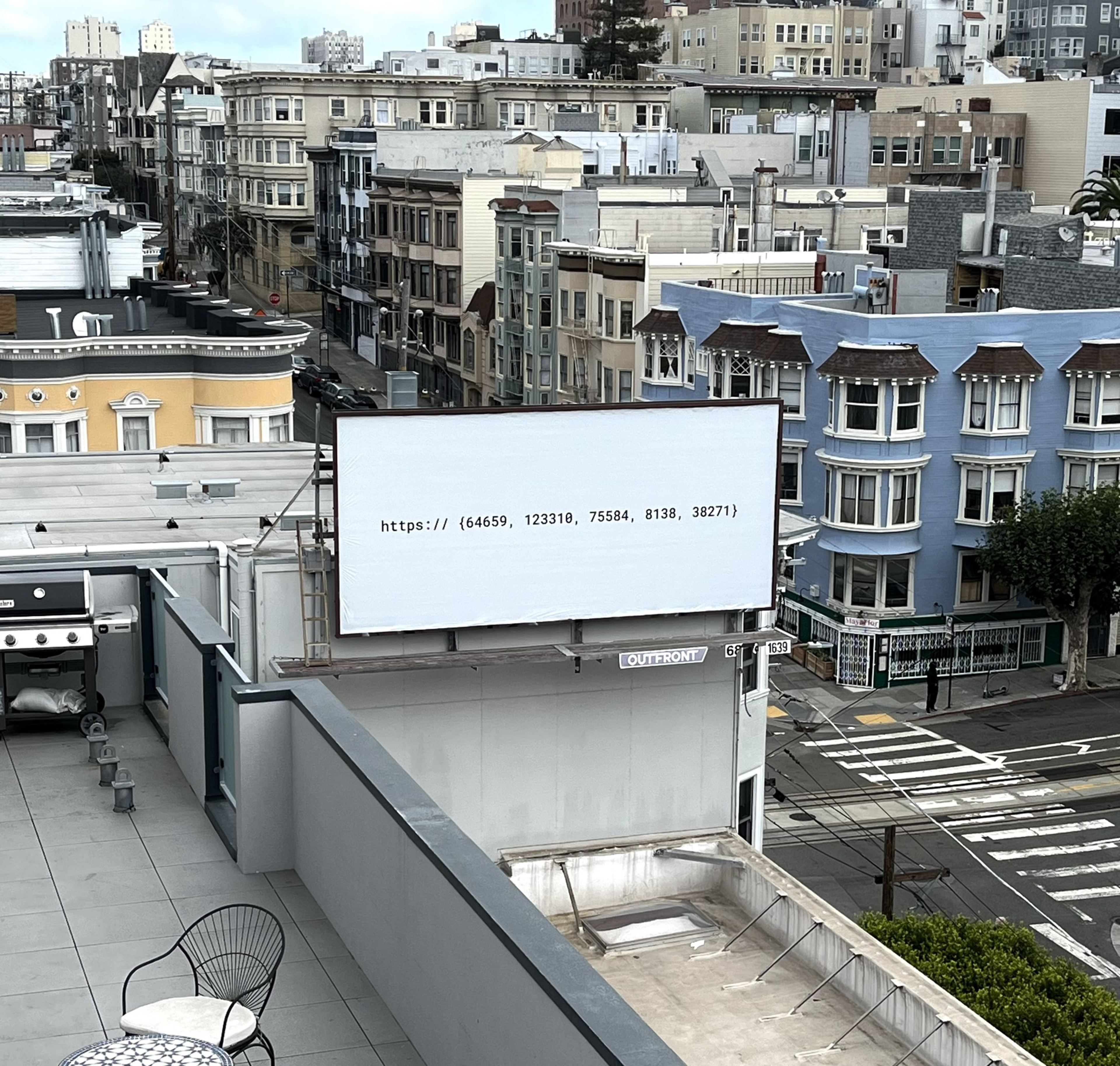 A rooftop view of a city block shows a large white billboard with text reading "https:// {64659, 123310, 75584, 8138, 38271}" above residential buildings.