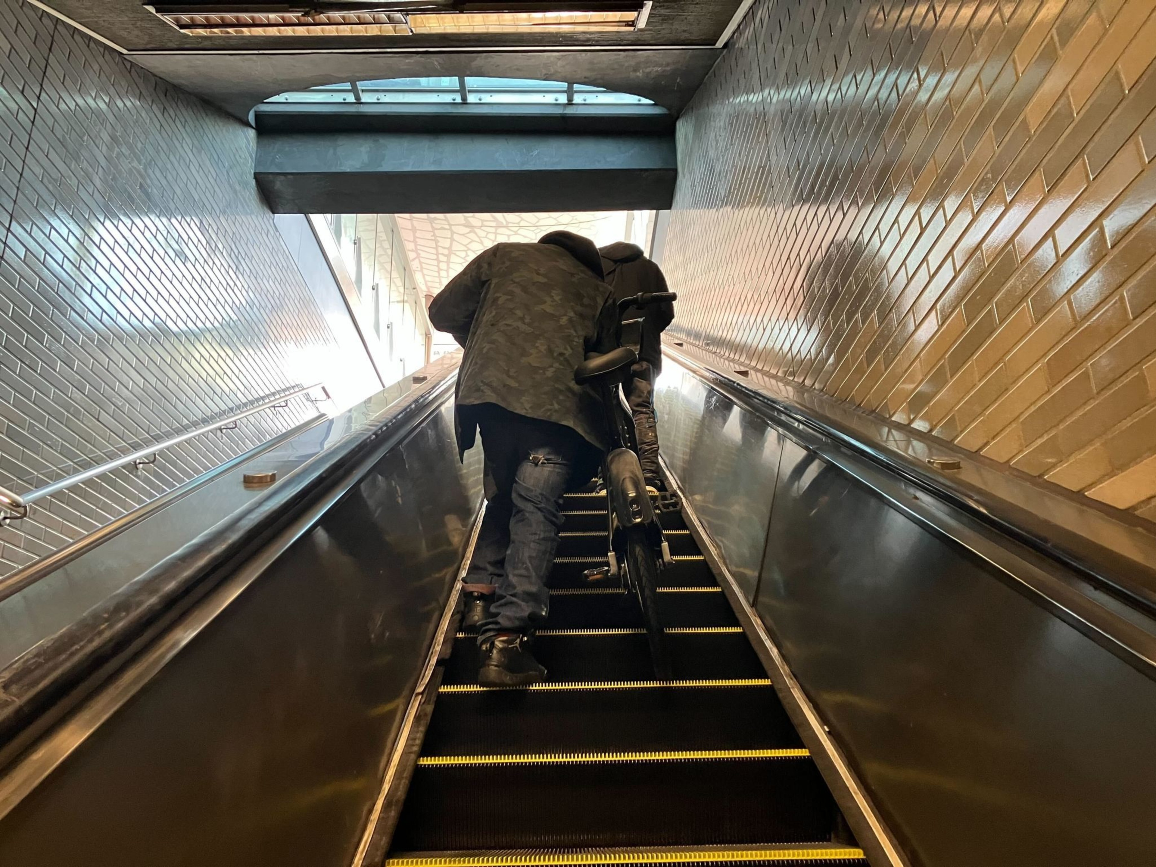 A BART rider takes a bicycle up the elevator at Civic Center Station on Jan. 9, 2024. New bike rules passed by BART's Board of Directors last year went into on New Year's Day.