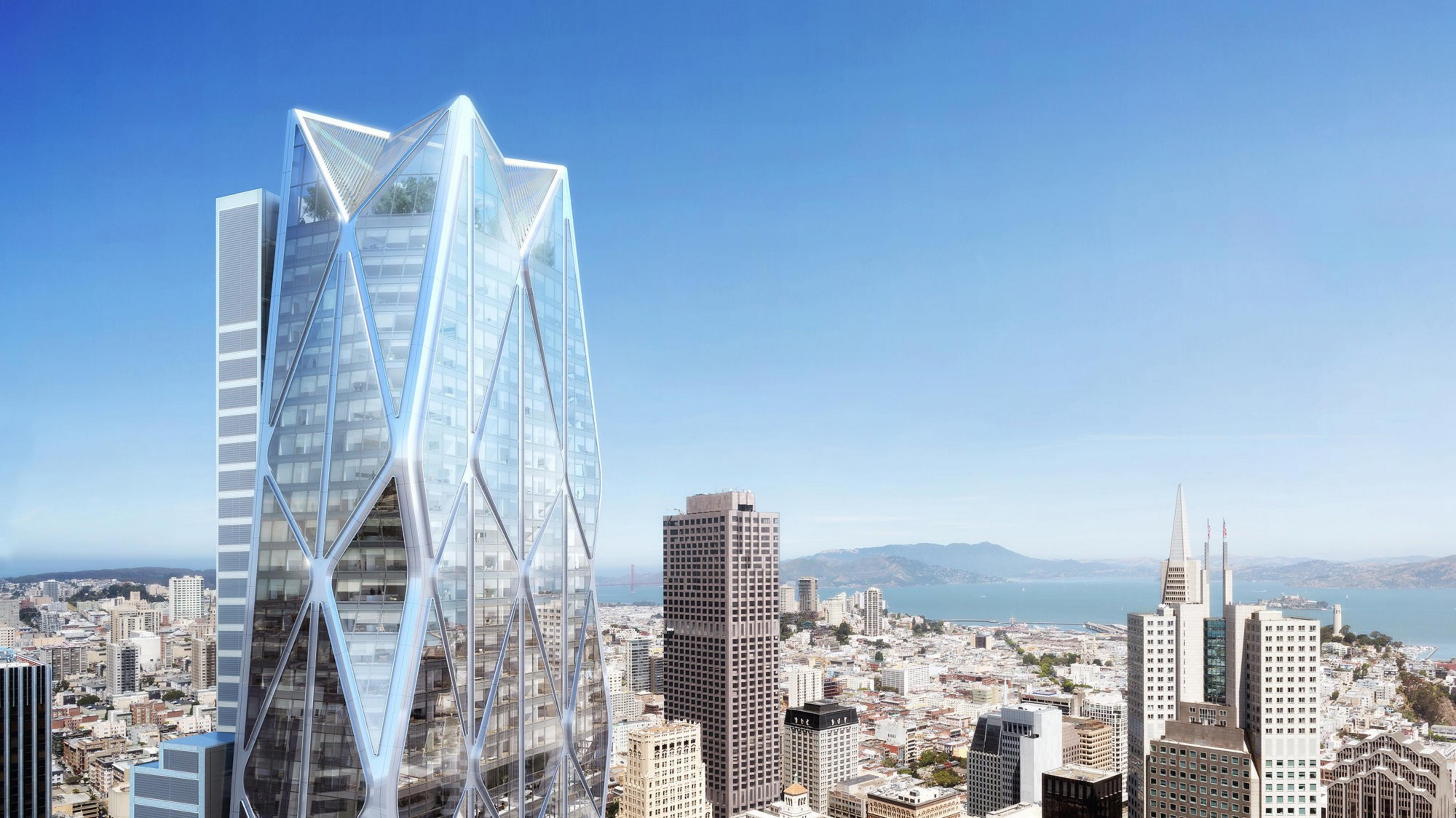 A futuristic skyscraper with a diamond-like structure stands out in a cityscape beneath a clear blue sky.