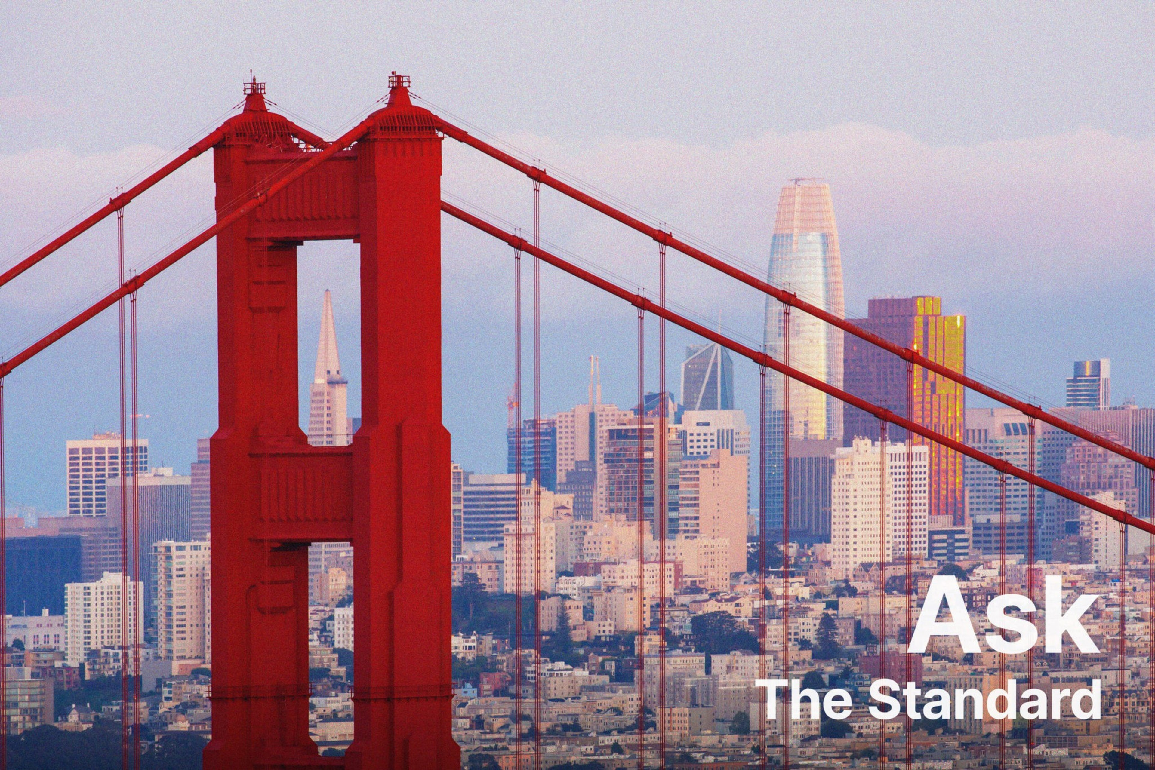 The Golden Gate Bridge with the city skyline in the background.