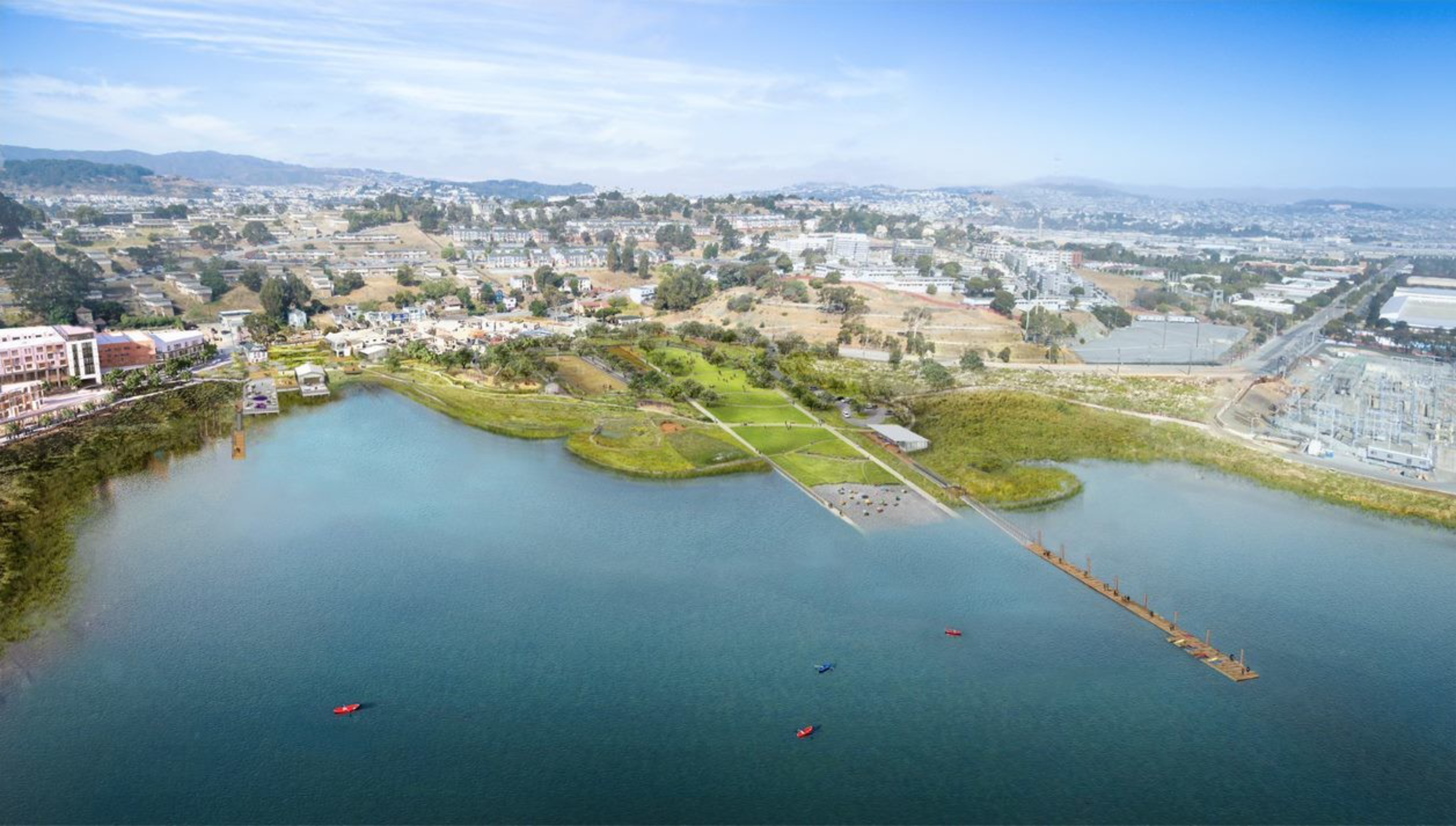 A lake with several small boats floats near a green park area with pathways, surrounded by urban buildings and distant hills under a clear blue sky.