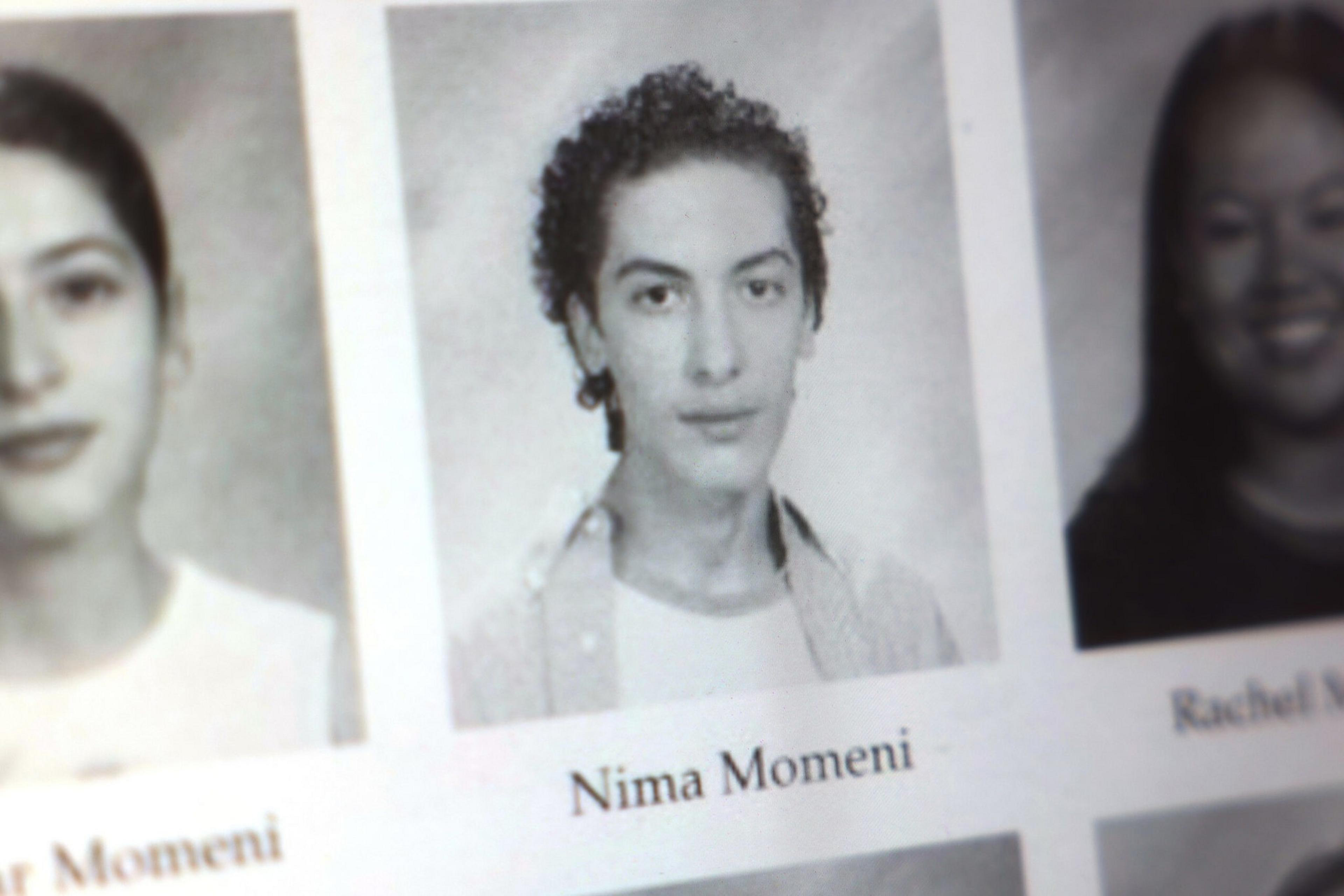 A black-and-white yearbook photo of a young person with curly hair, wearing a shirt over a t-shirt, labeled "Nima Momeni."