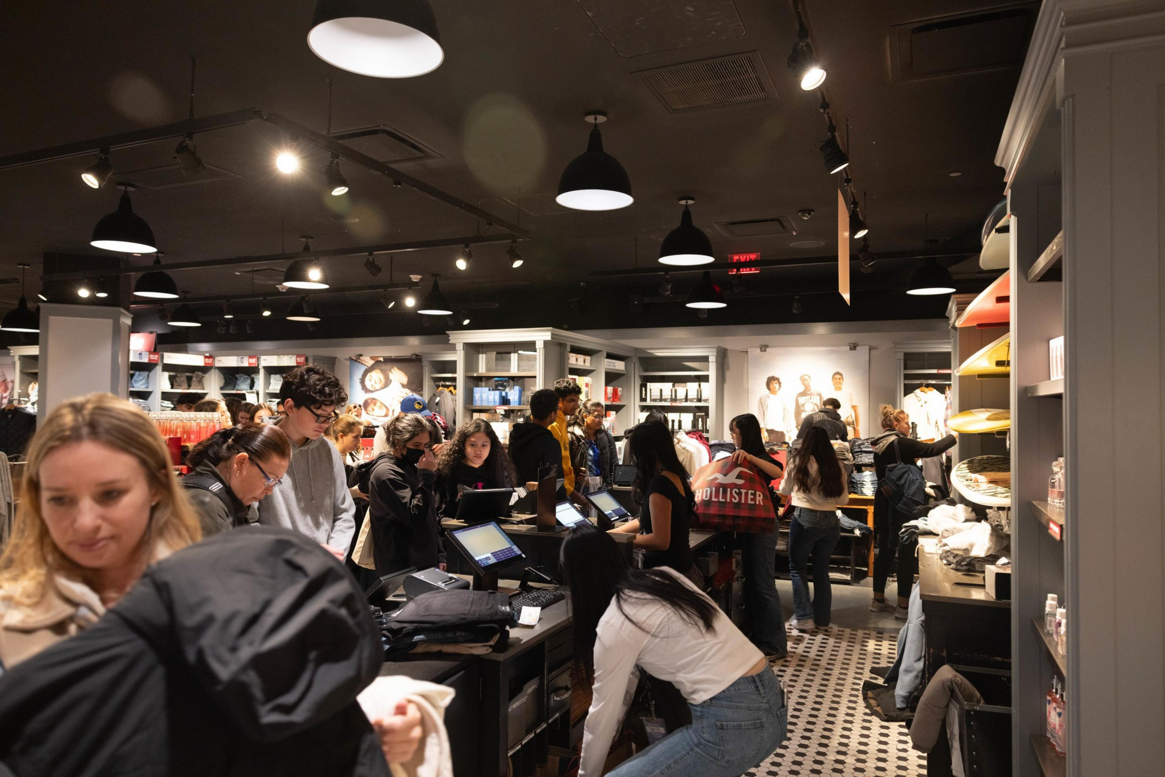 Many people line up inside Hollister in San Francisco Centre.