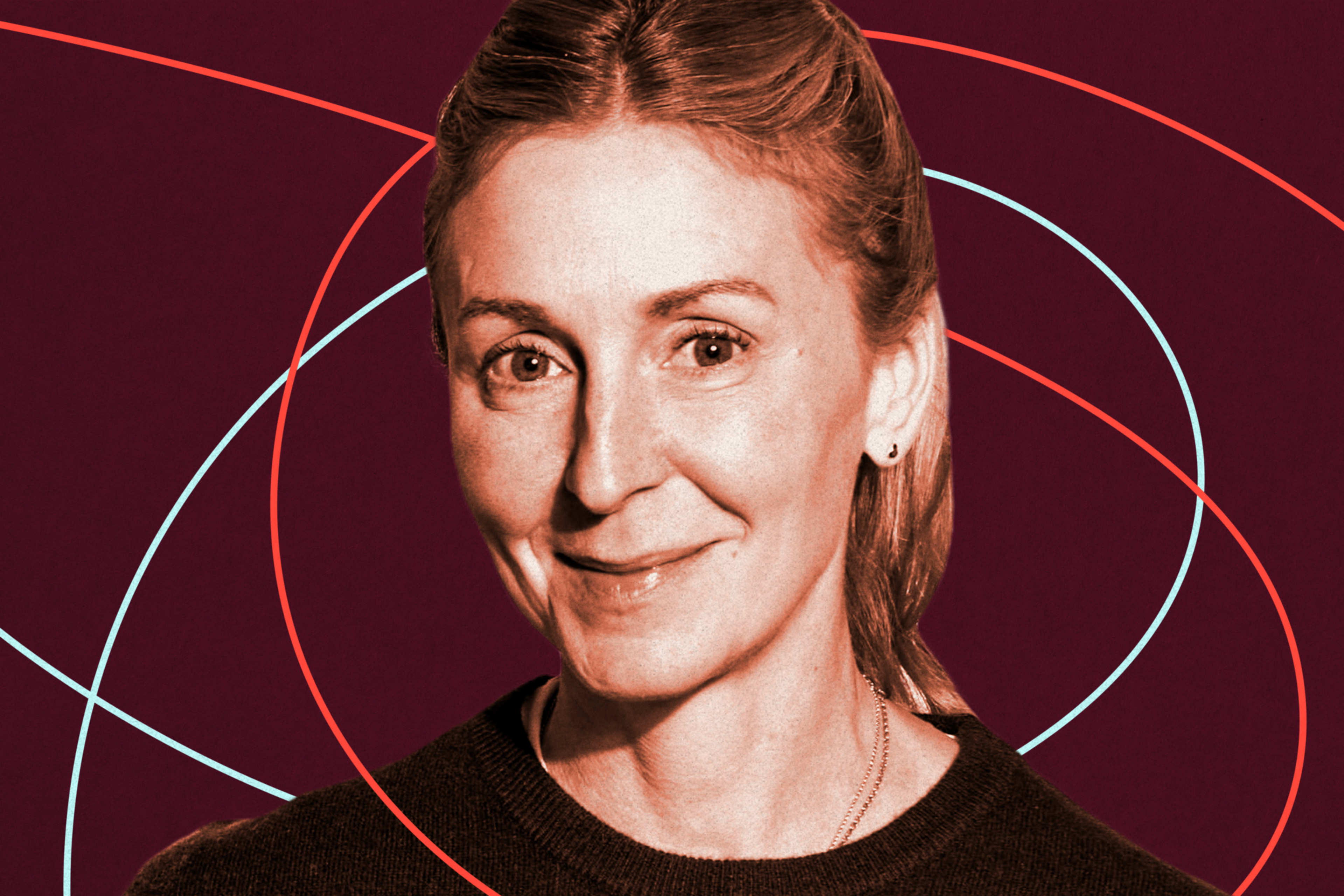 A woman with light skin and blonde hair pulled back smiles gently, wearing a dark top with a maroon background featuring curved blue and red lines.