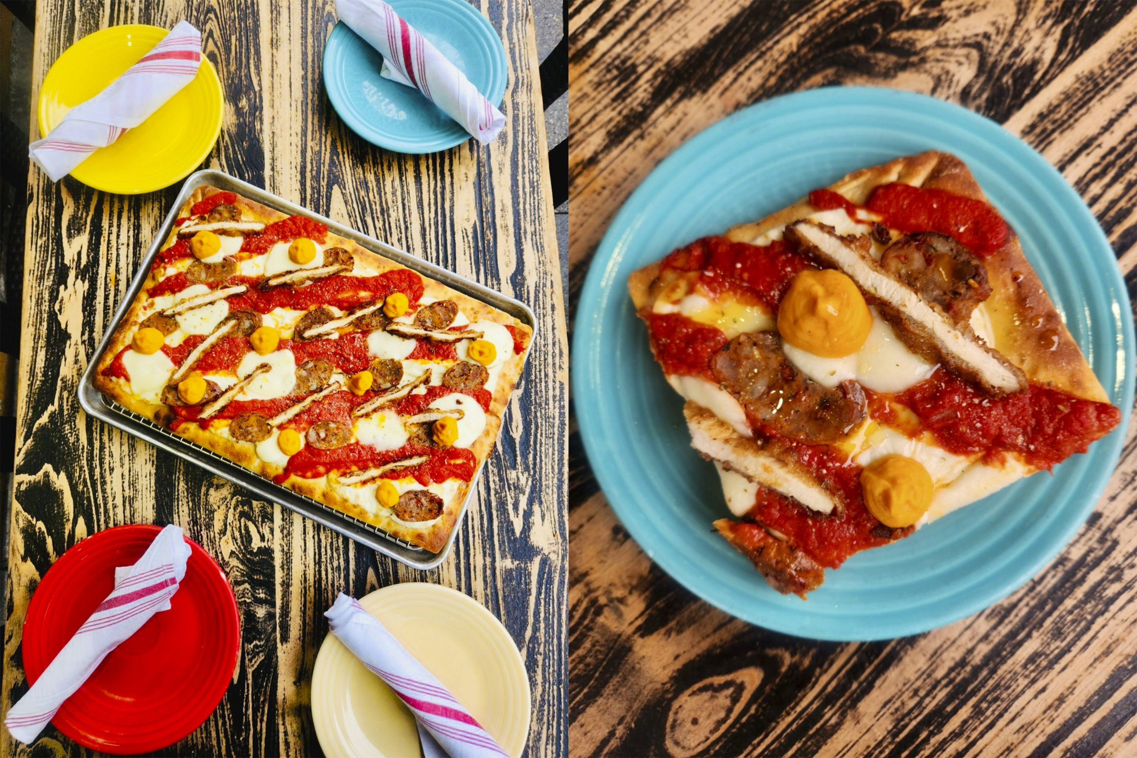 Two slices of pizza stand on a wooden table.