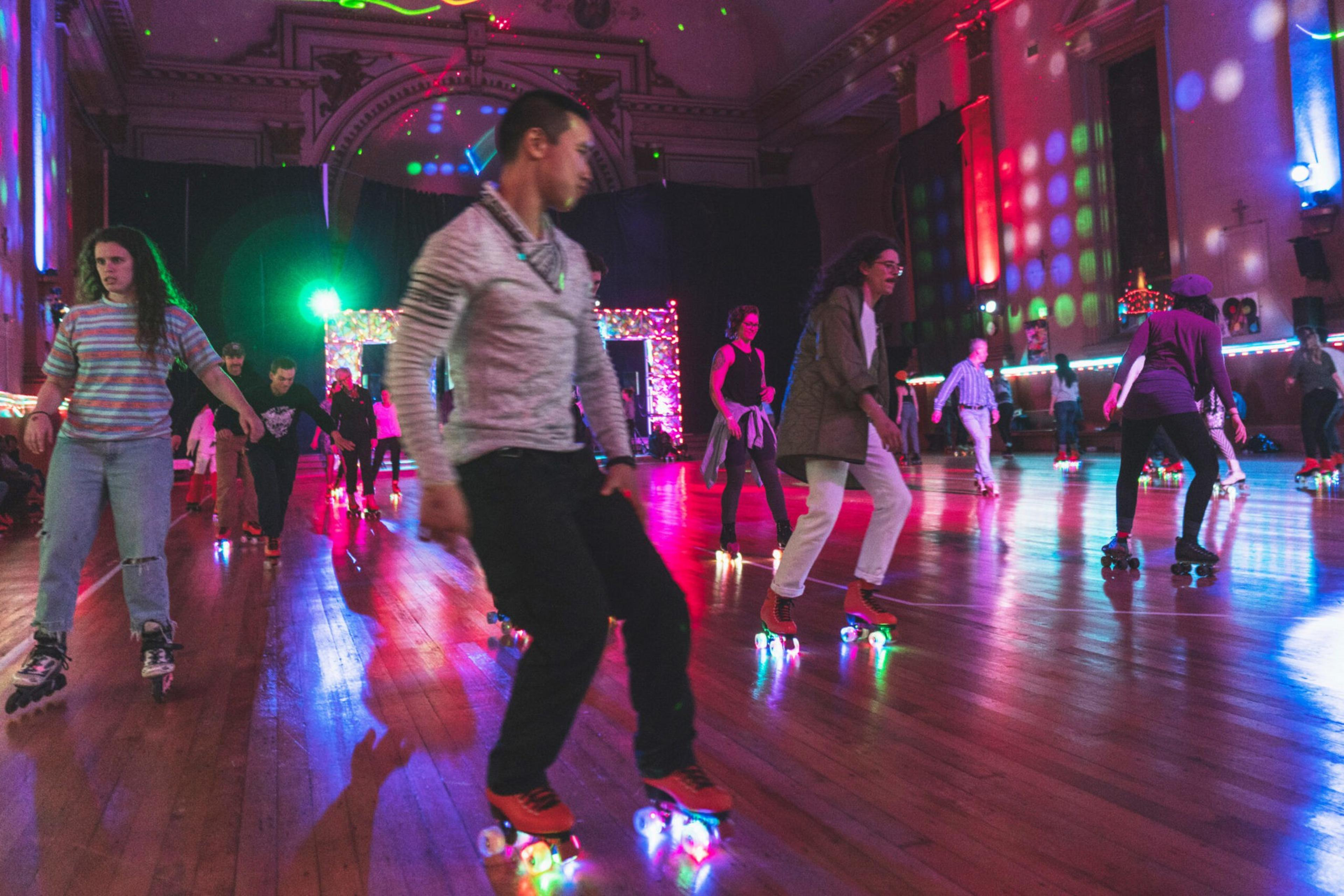 Rollerskaters enjoy the scene at Church of 8 Wheels in San Francisco.