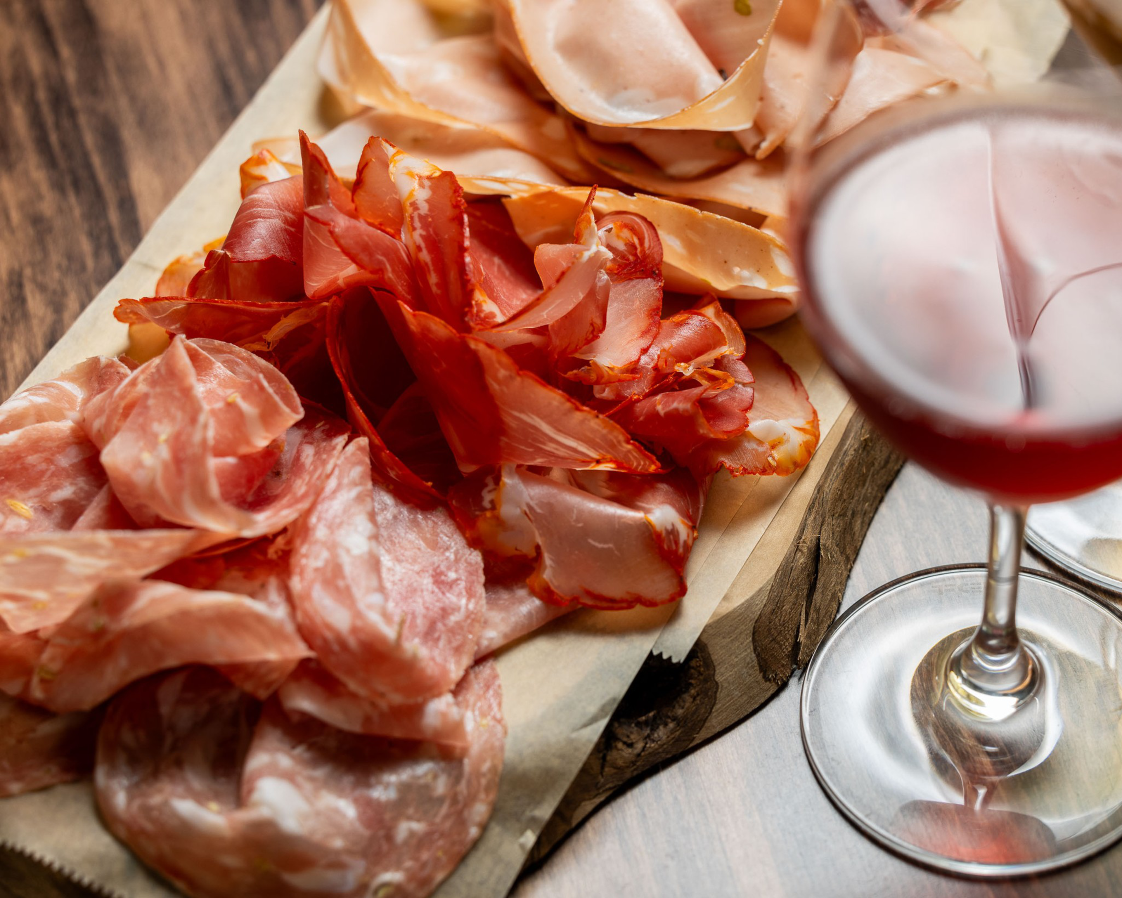 Plate of cured meats and wine