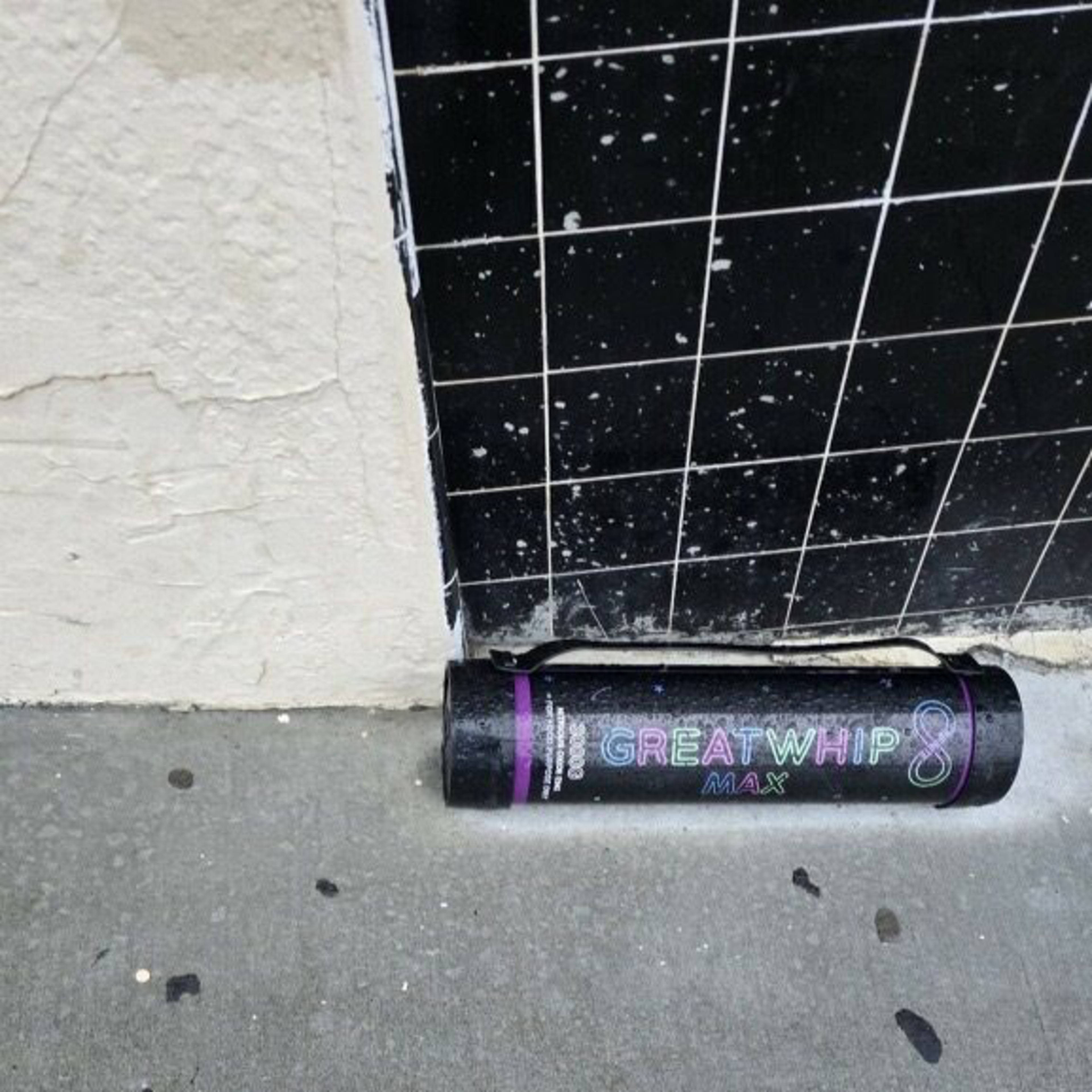 A can of whip on the ground