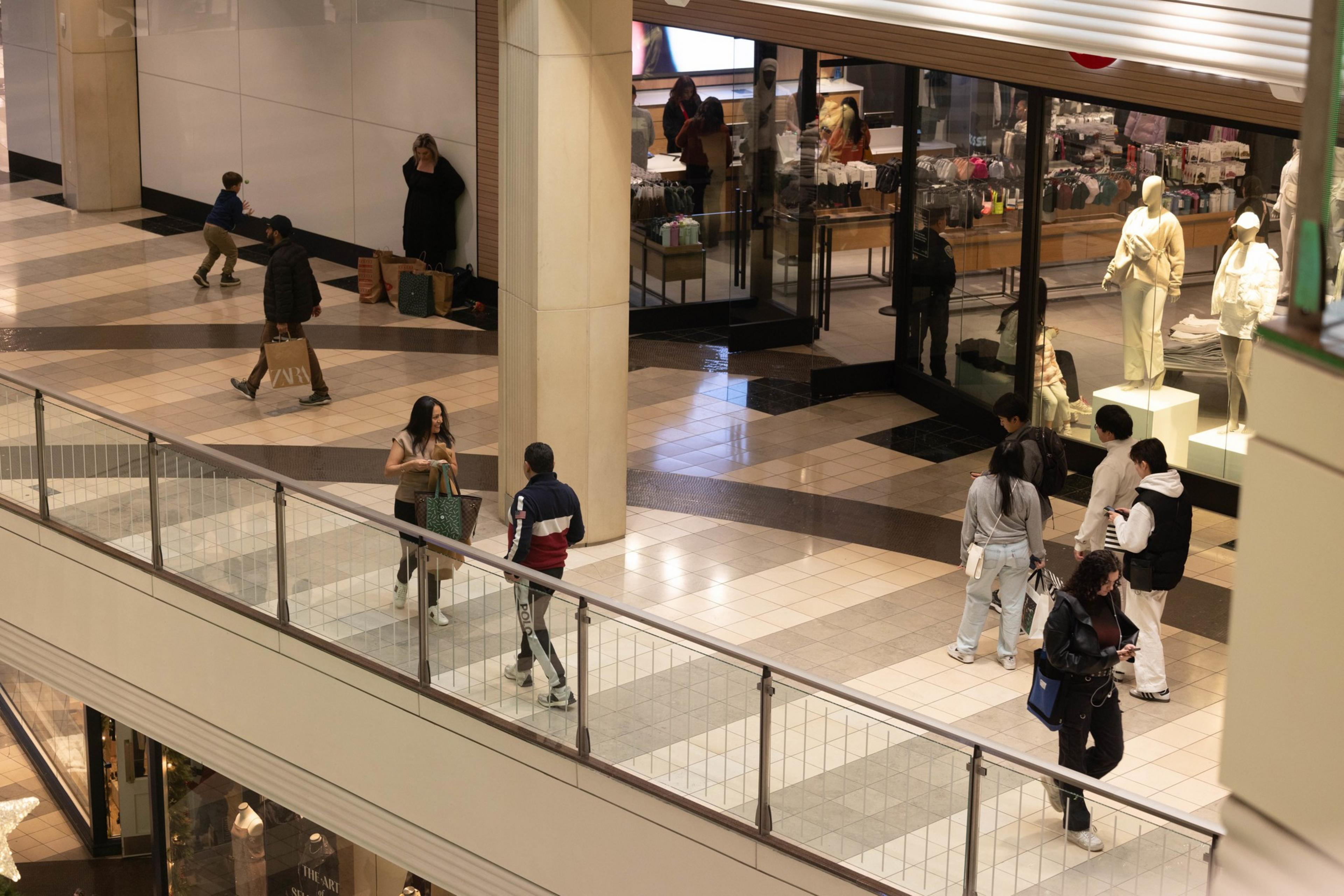 Shoppers walk in San Francisco Centre.