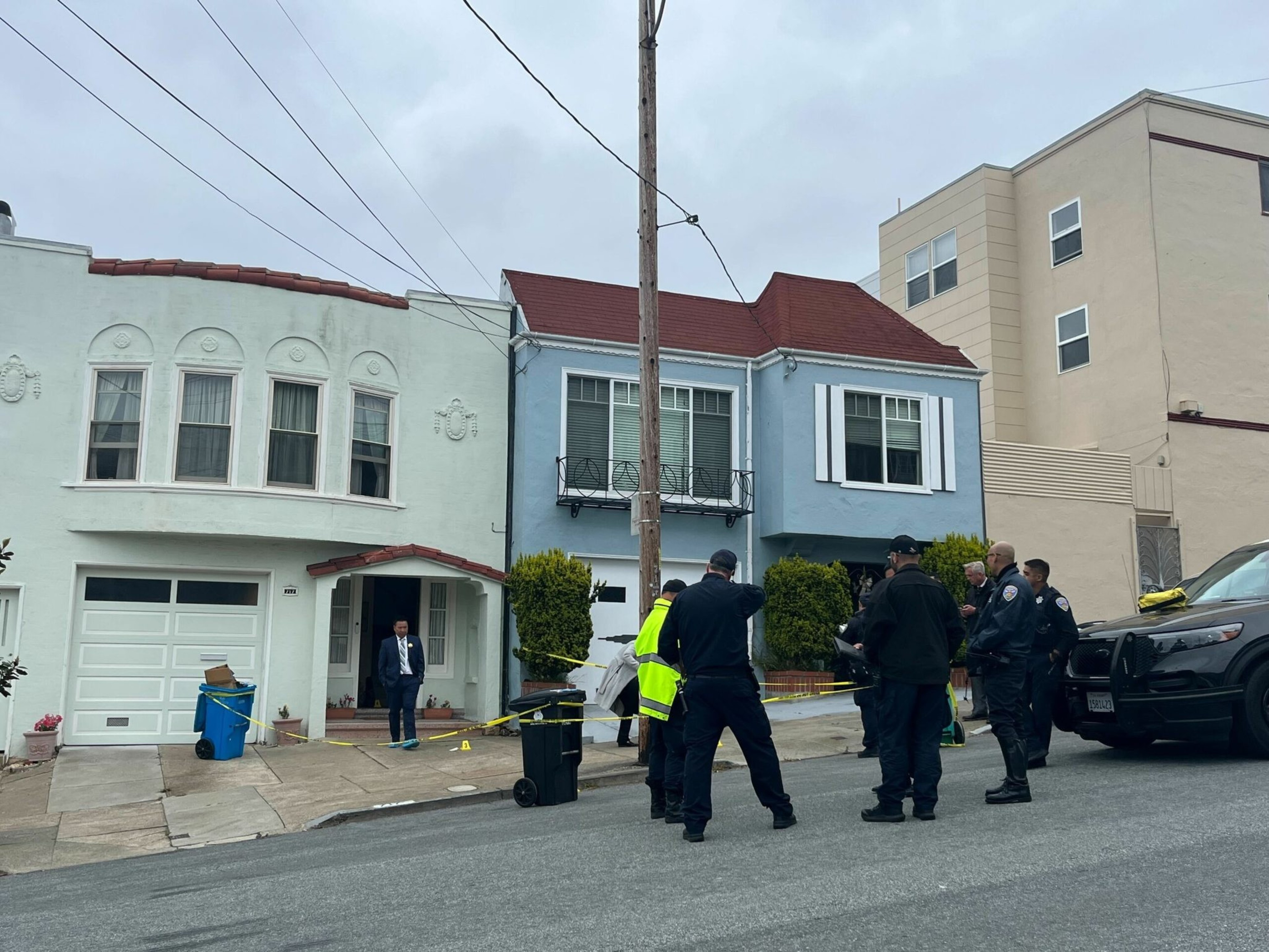 San Francisco police officers gather outside a home on 31st Avenue in the Richmond neighborhood after an officer shot a person in the early hours of June 2, 2023. | Ida Mojadad/The Standard