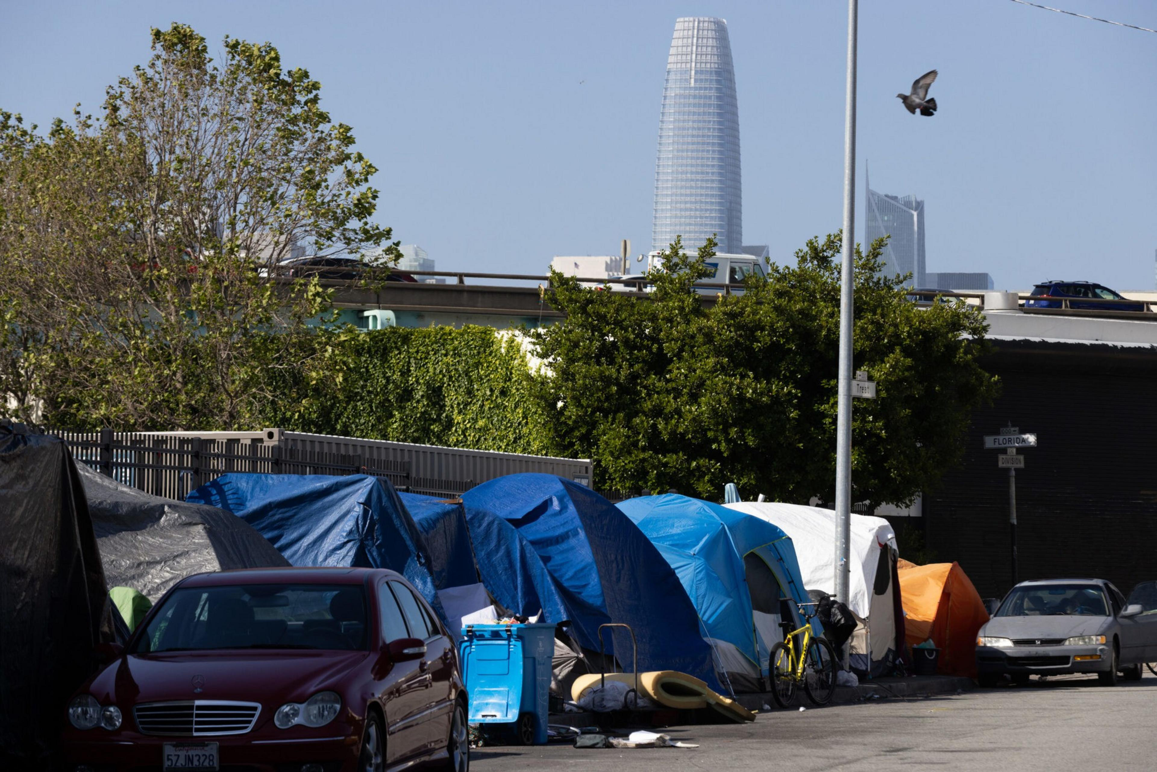 A homeless tent encampment on Division Street at Florida Street with Salesforce Tower in the skyline in San Francisco, on Thursday, June 1, 2023. The homeless crisis in the Bay Area continues and local residents arenâ€™t sure when and if they should be given