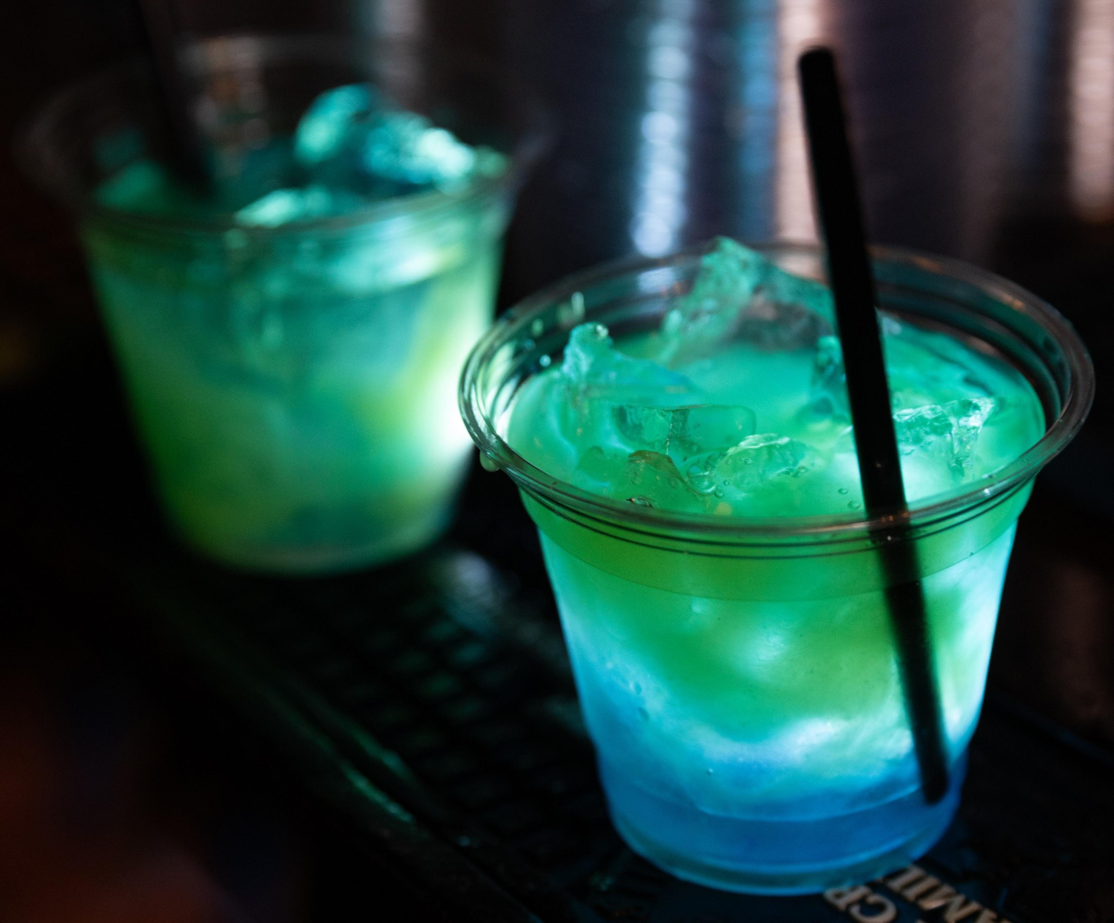 Drinks sit on a bar.