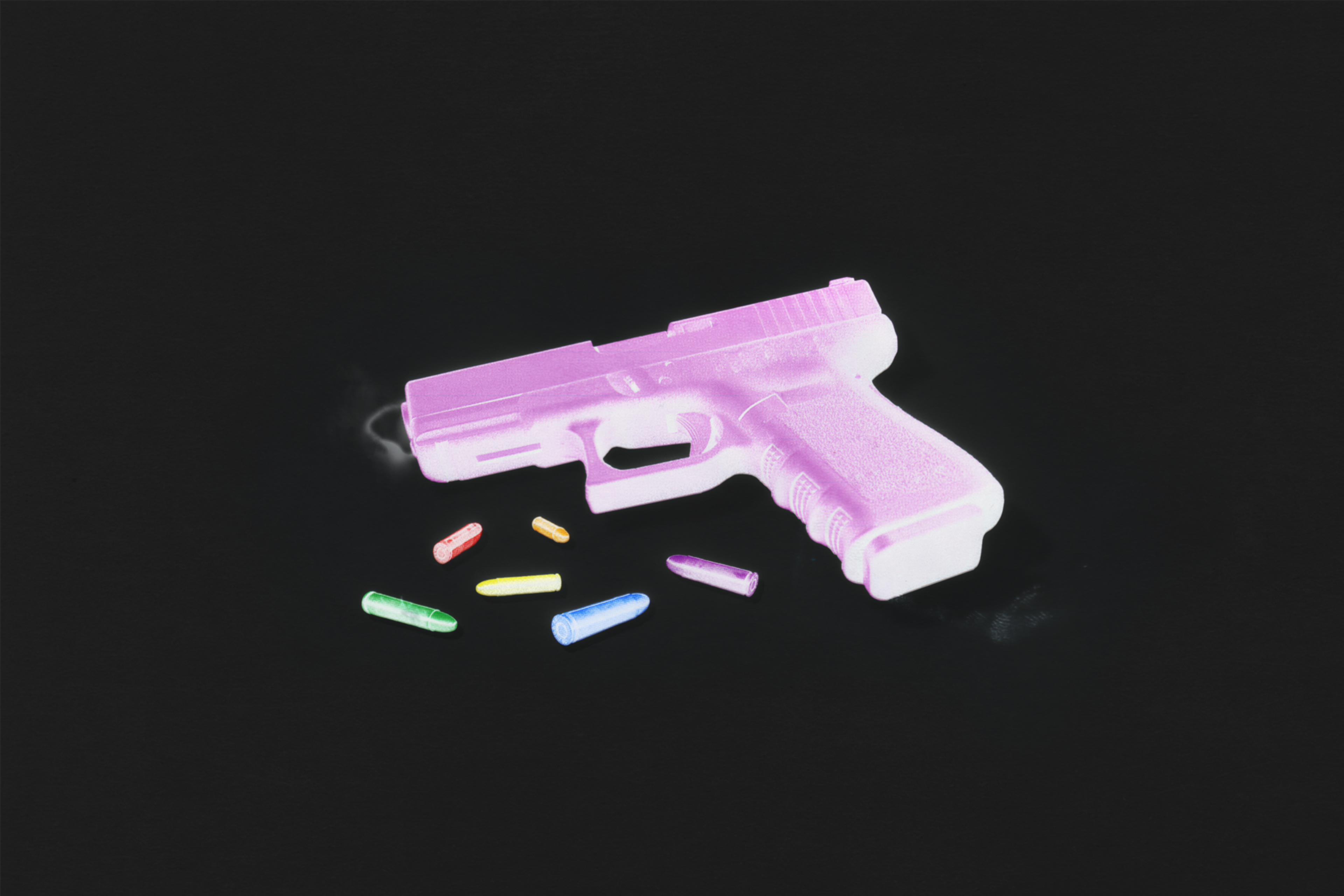 A photo illustration of a pink gun and bullets
