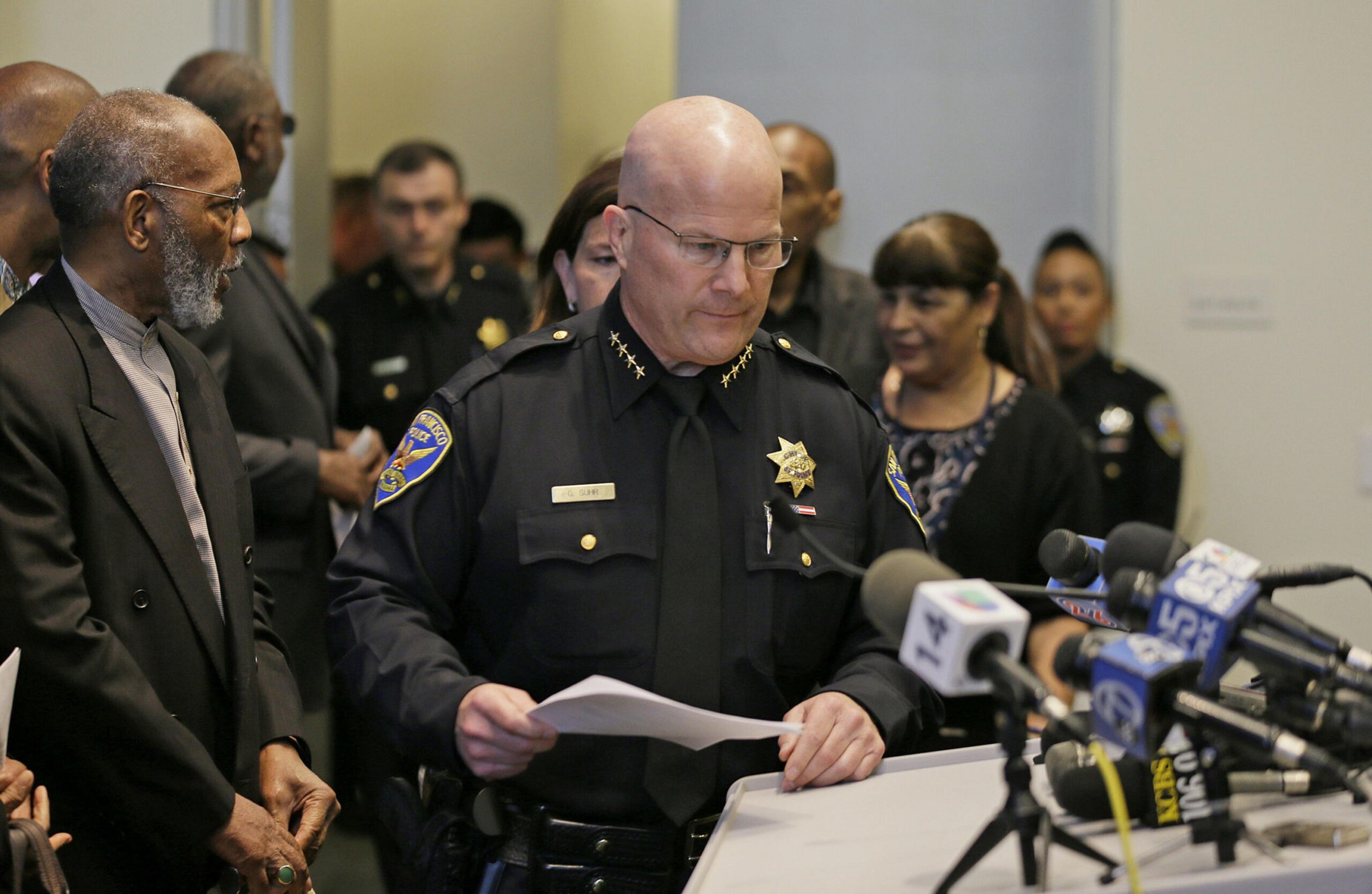 A police officer at a press conference.