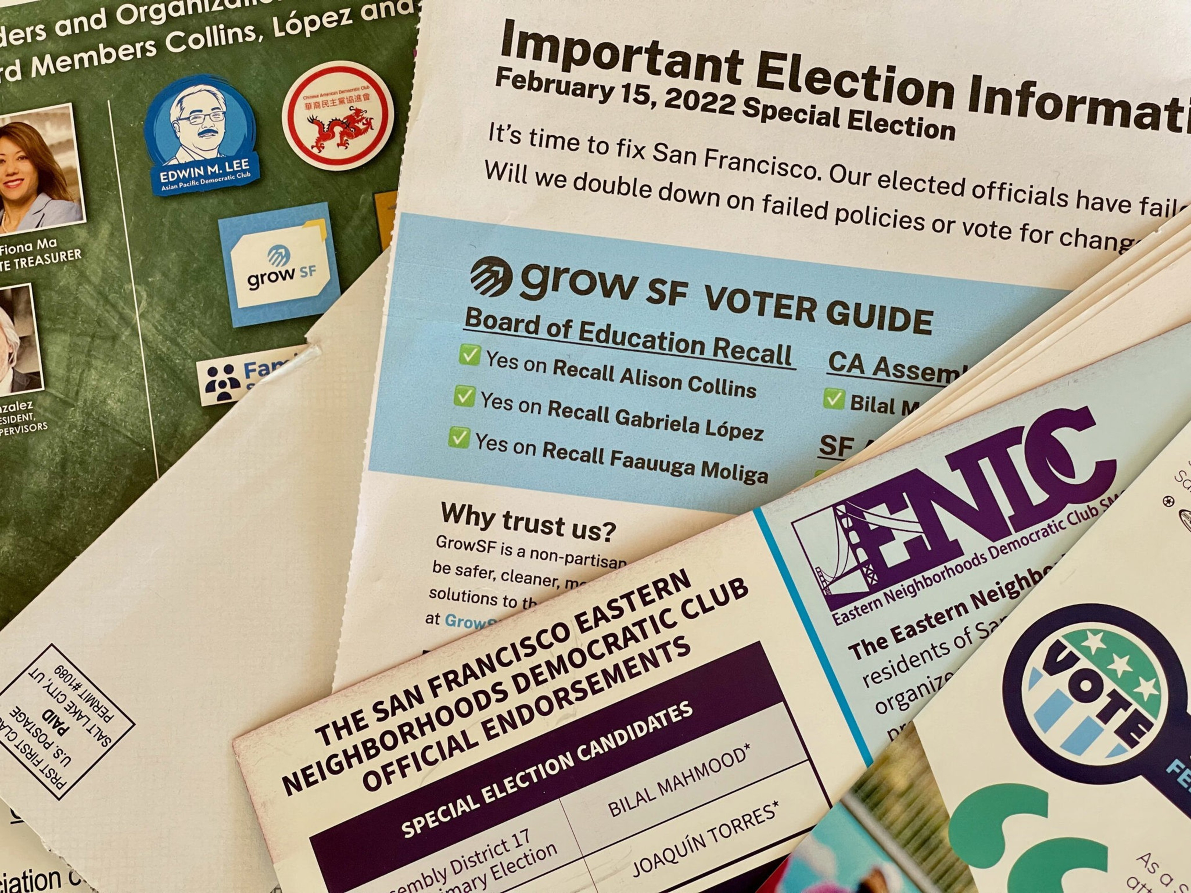 Election flyers and voter guides for the February 15, 2022 San Francisco special election, featuring candidate recalls and endorsements from local organizations.
