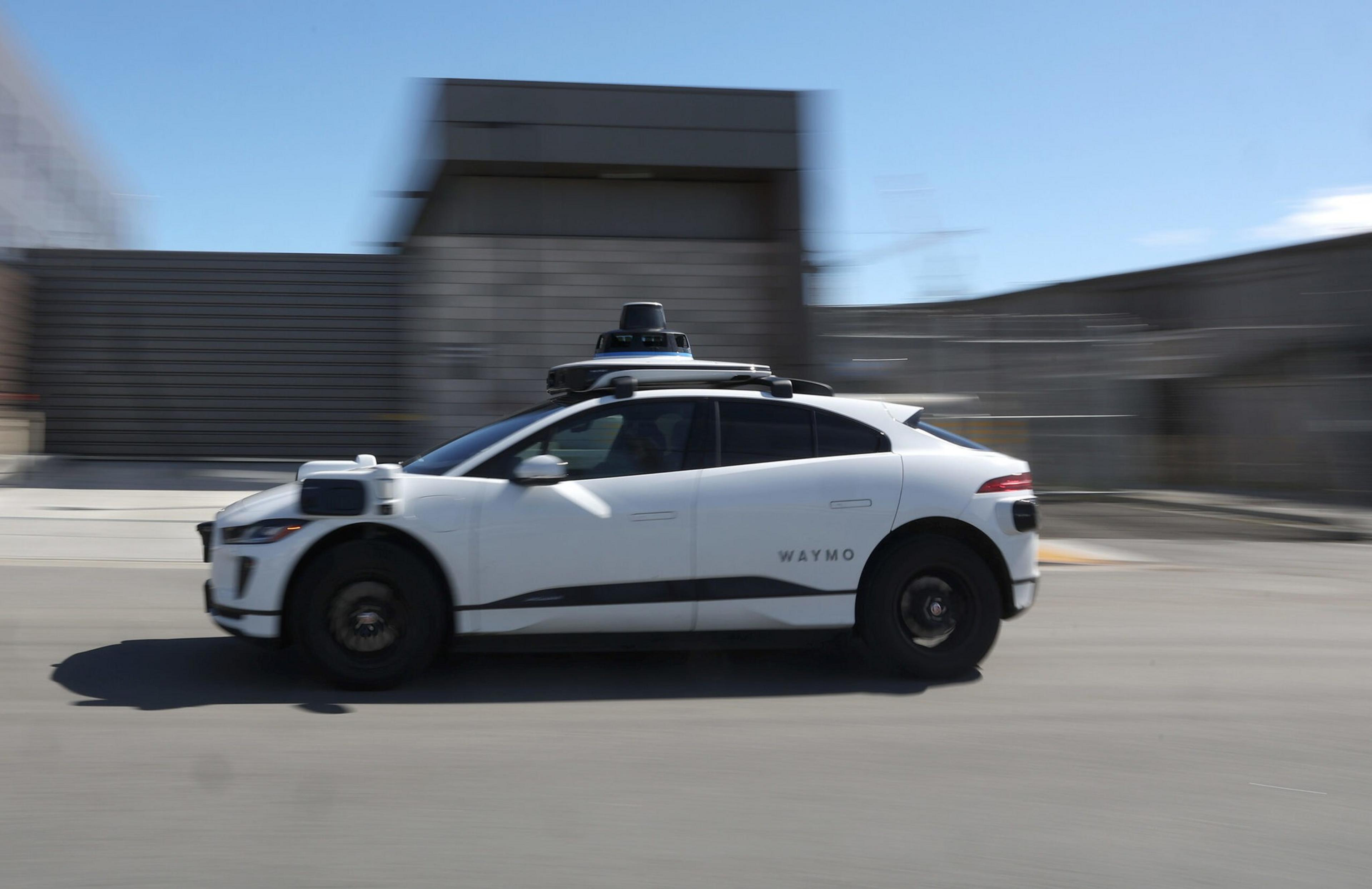 A robotaxi speeding down a street