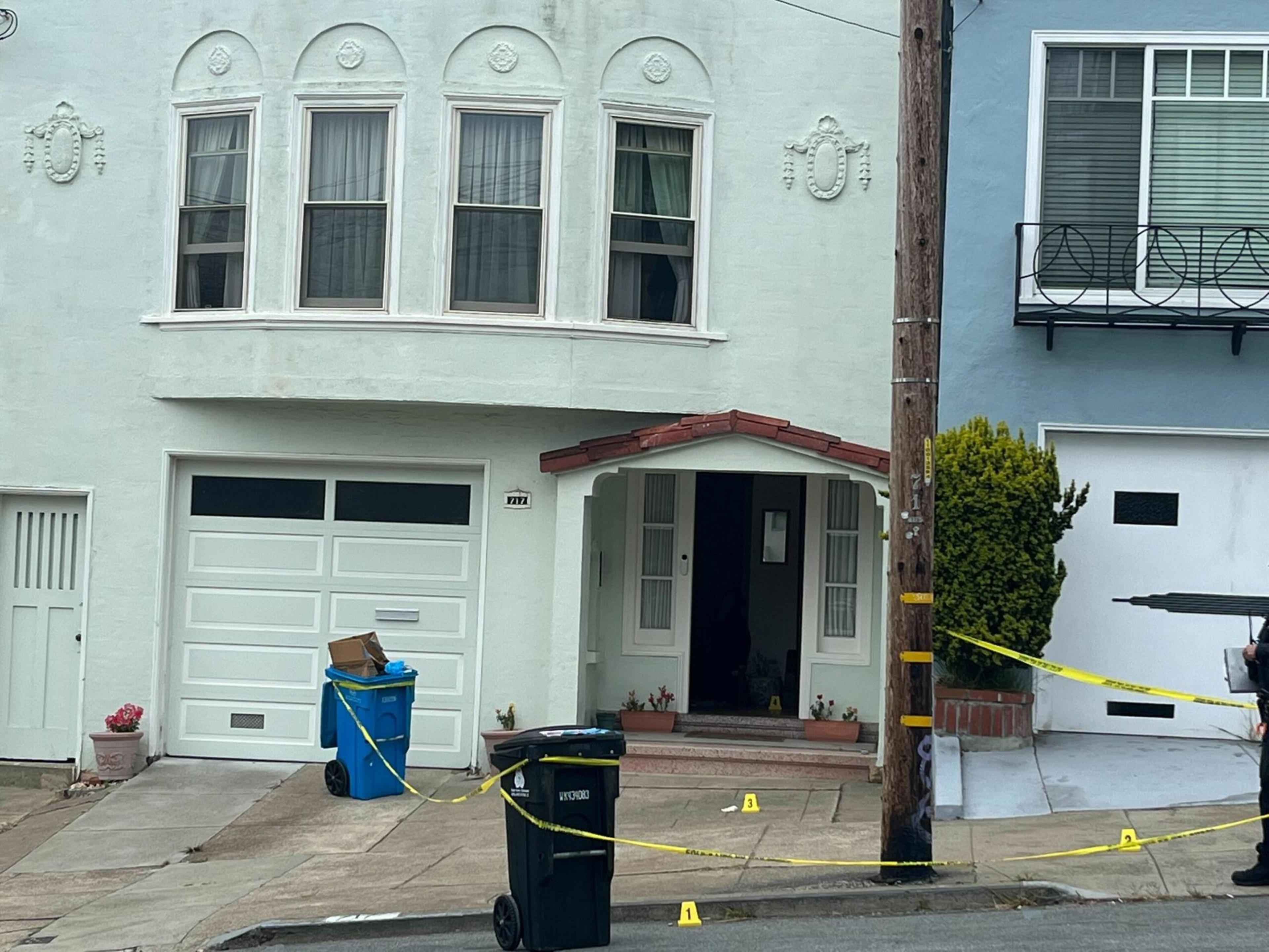 San Francisco police officers gather outside a home on 31st Avenue in the Richmond neighborhood after an officer shot a person in the early hours of June 2, 2023. | Ida Mojadad/The Standard