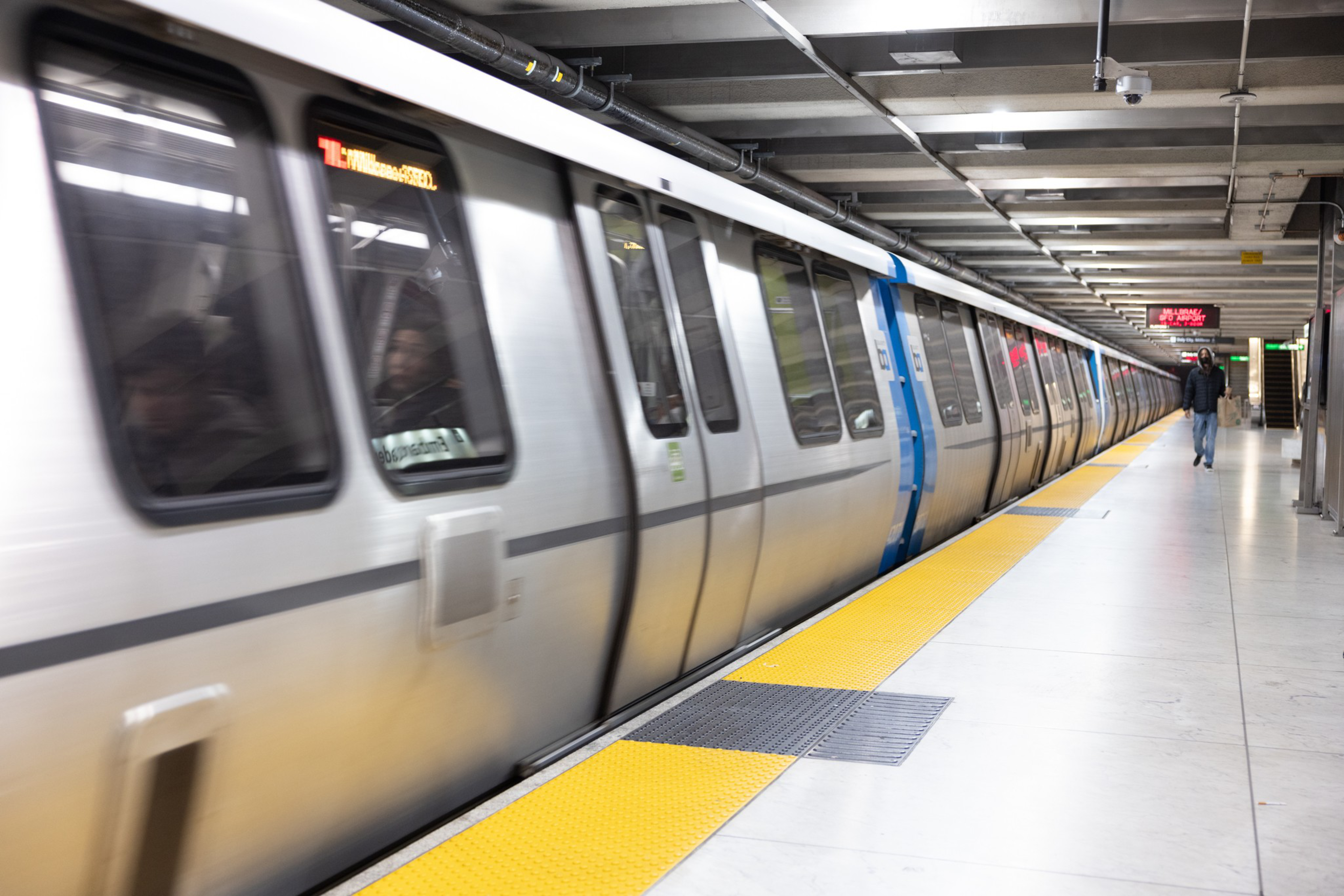 a bart train is seen at a station platform