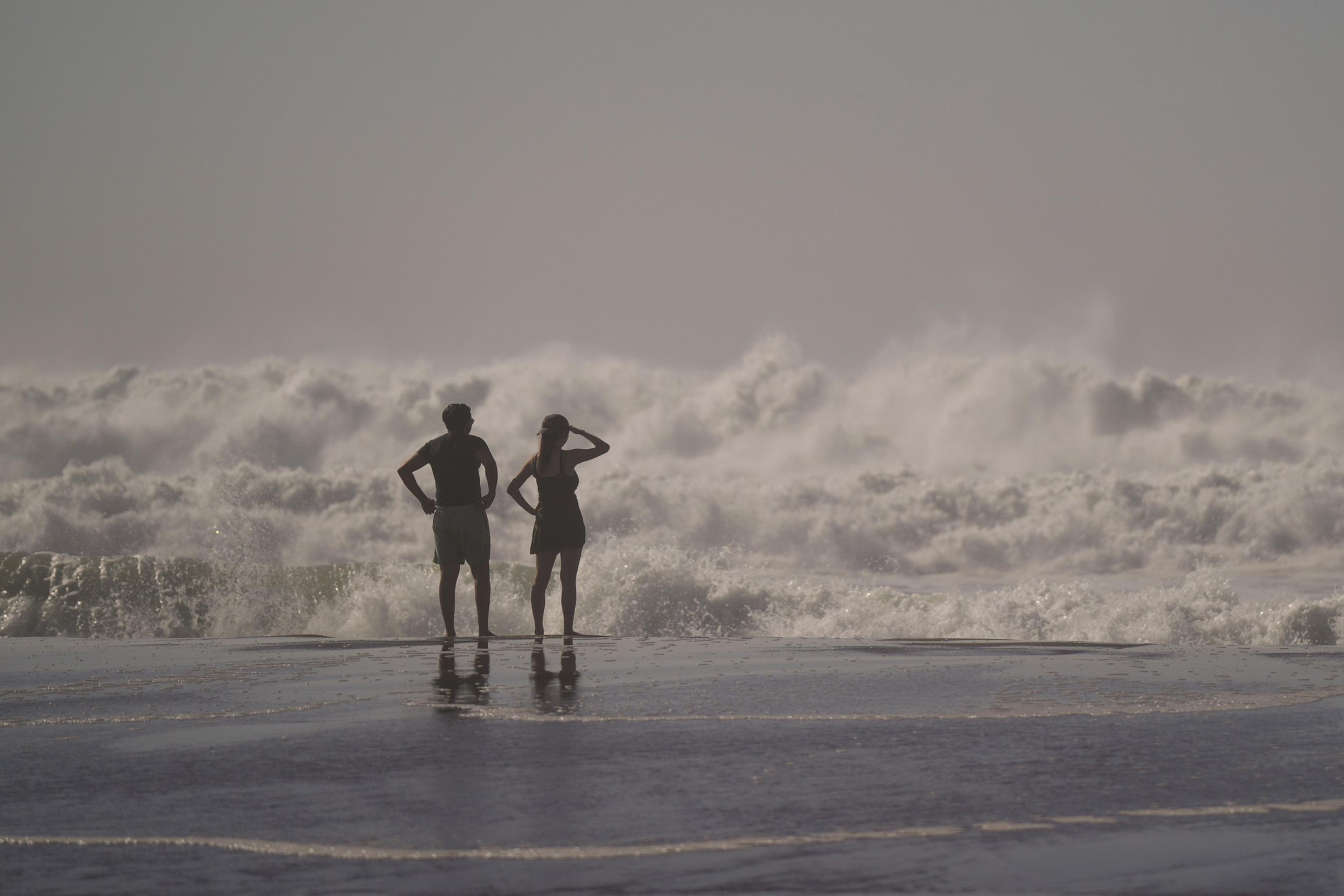 A silhouette of a man and woman.