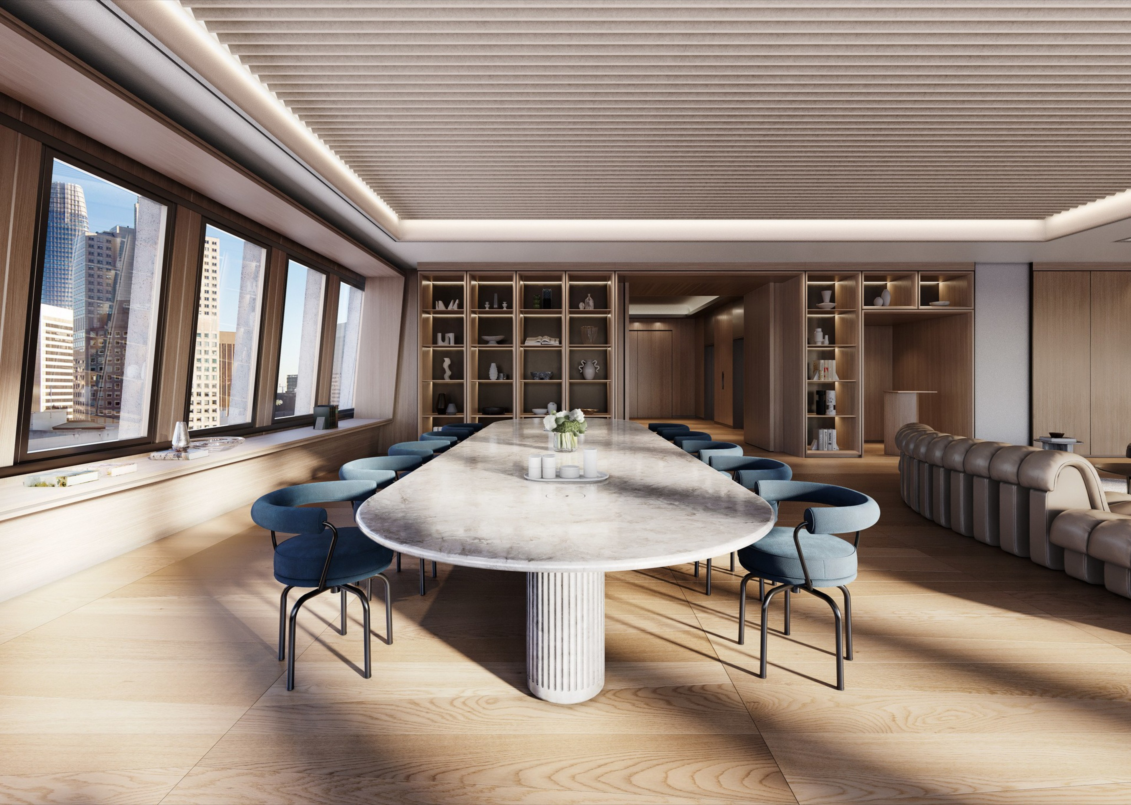 A modern conference room with a long marble table, blue chairs, large windows showing a cityscape, and wooden shelves with decorative items.