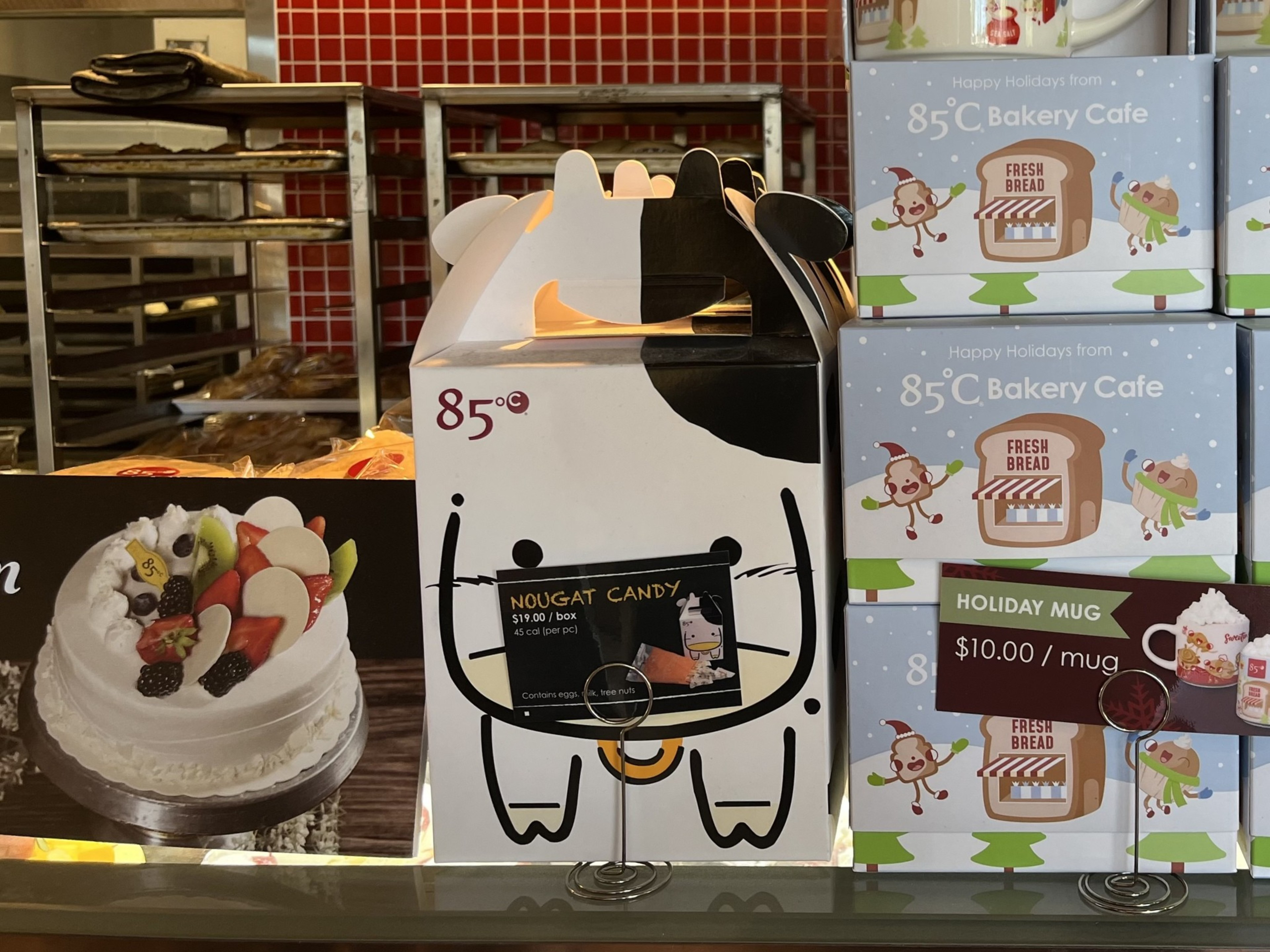 A box of nougat candy and other holiday gifts.